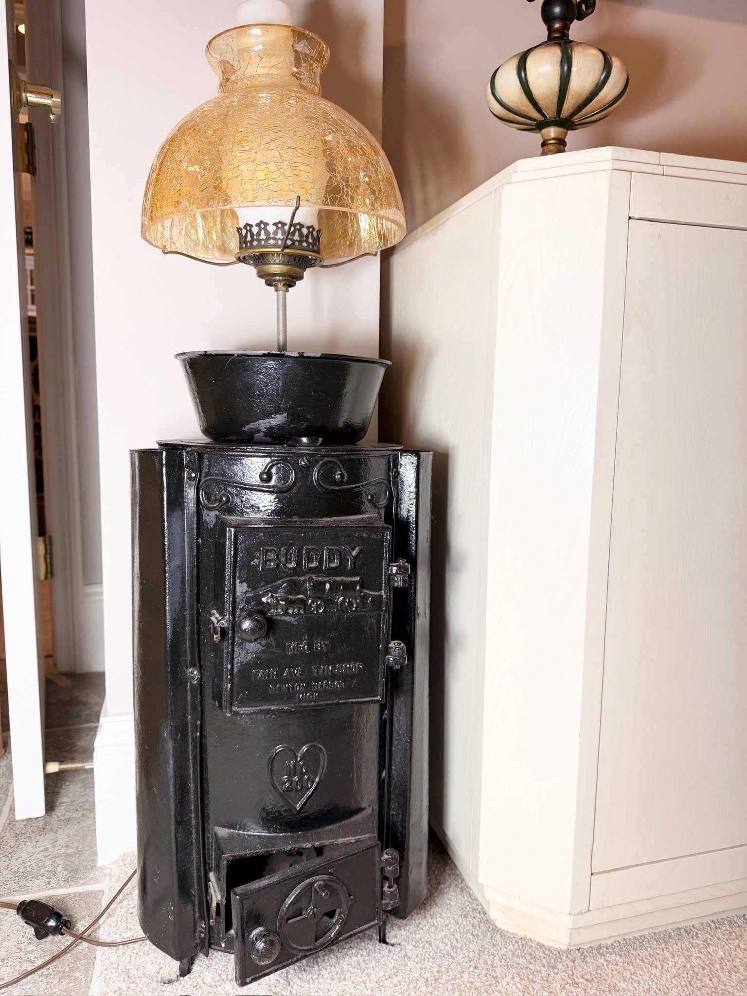 Unique vintage "Buddy No. 200" cast iron stove repurposed into an electric lamp.