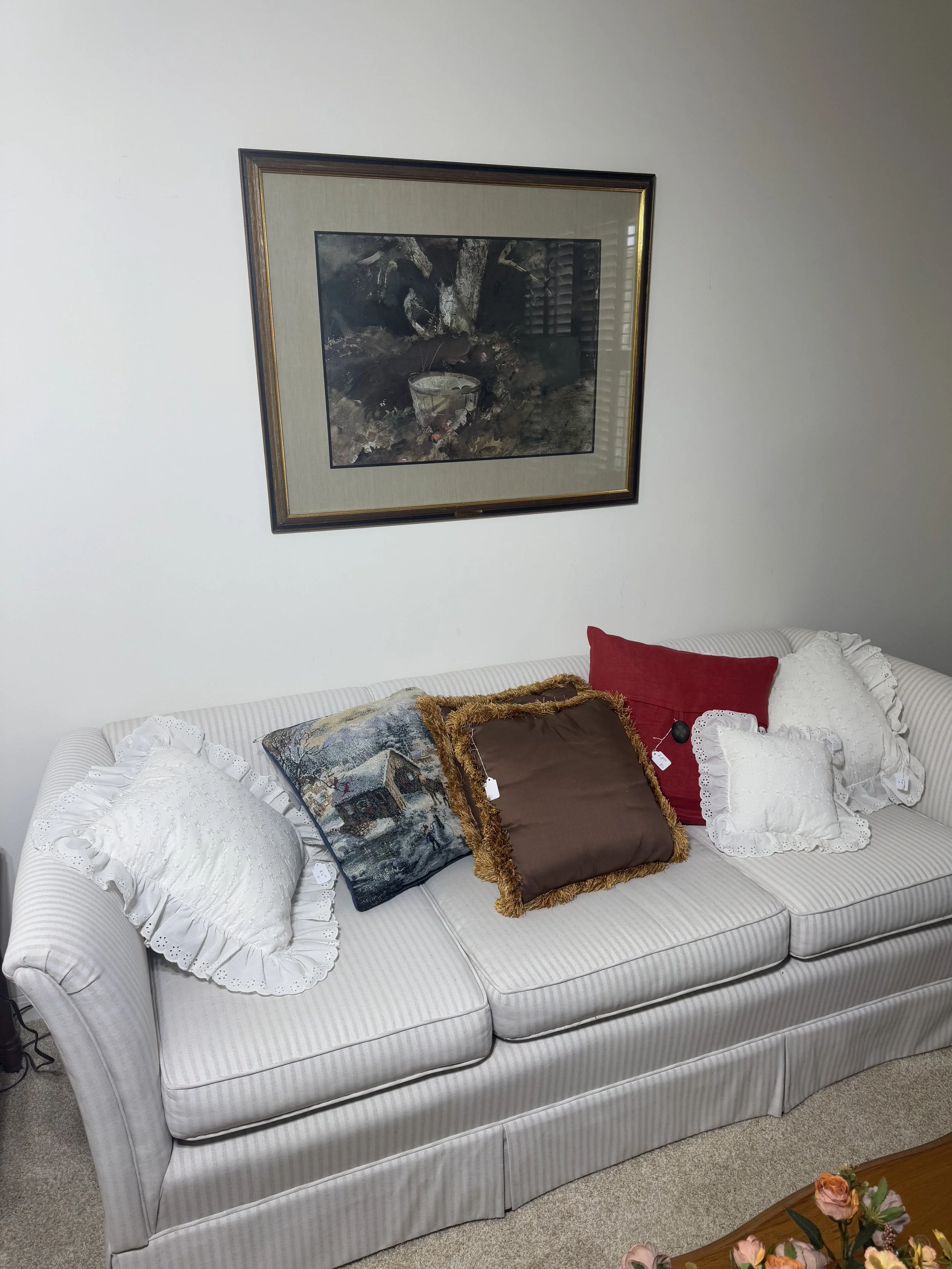 striped 3 seat sofa and decorative pillows