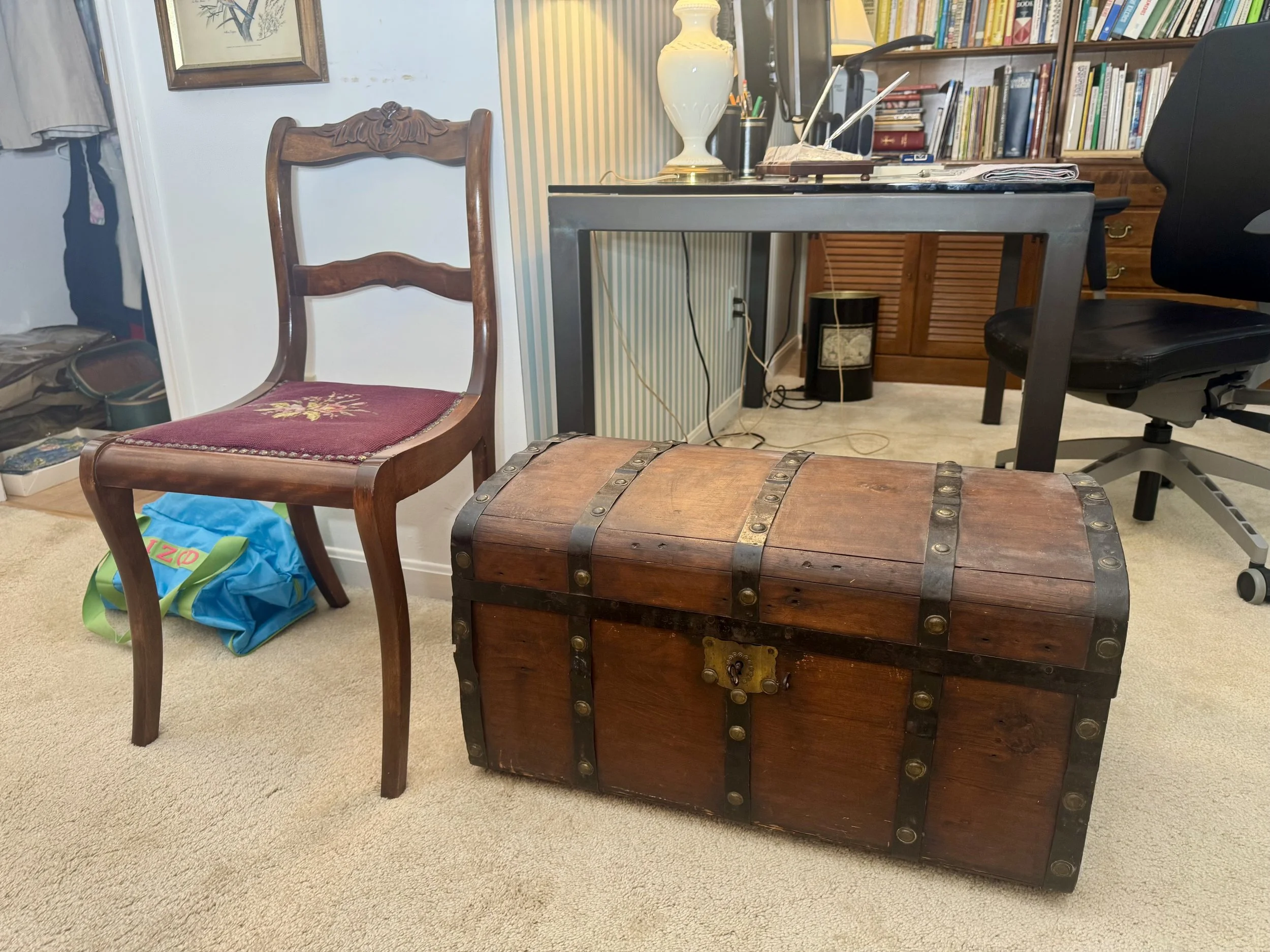 Mid-19th-century Jenny Lind style trunk on wheels and vintage Duncan Phyfe-style mahogany side chair with carved back and needlepoint seat