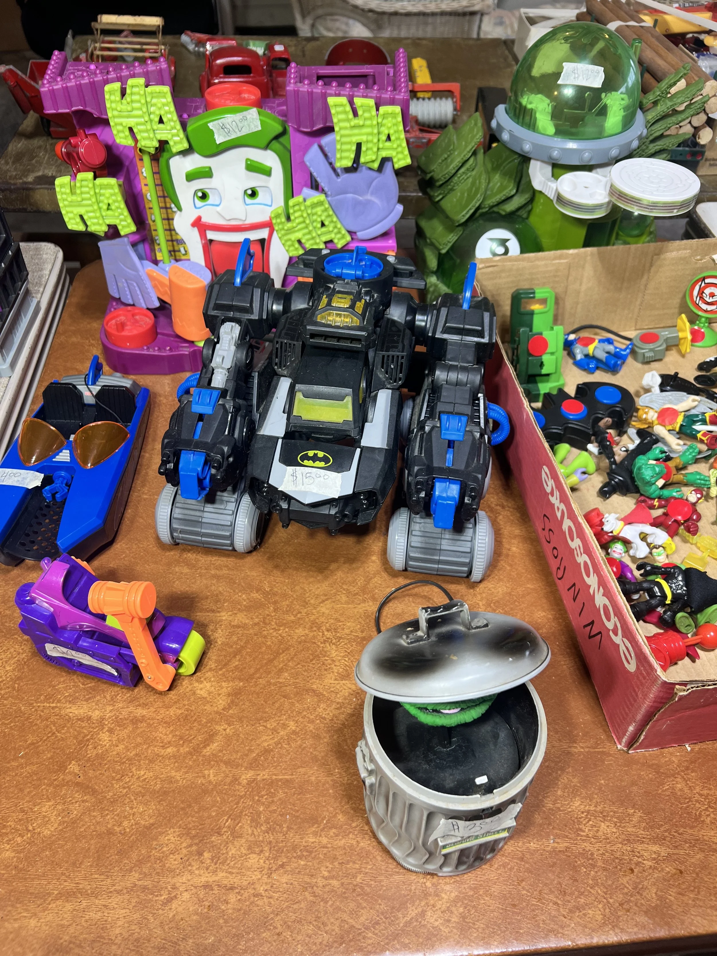 Joker’s Fun House & Action Figures – DC Super Friends Imaginext Joker's Fun House playset with a large assortment of heroes and villains, including a motorized Bat-tank