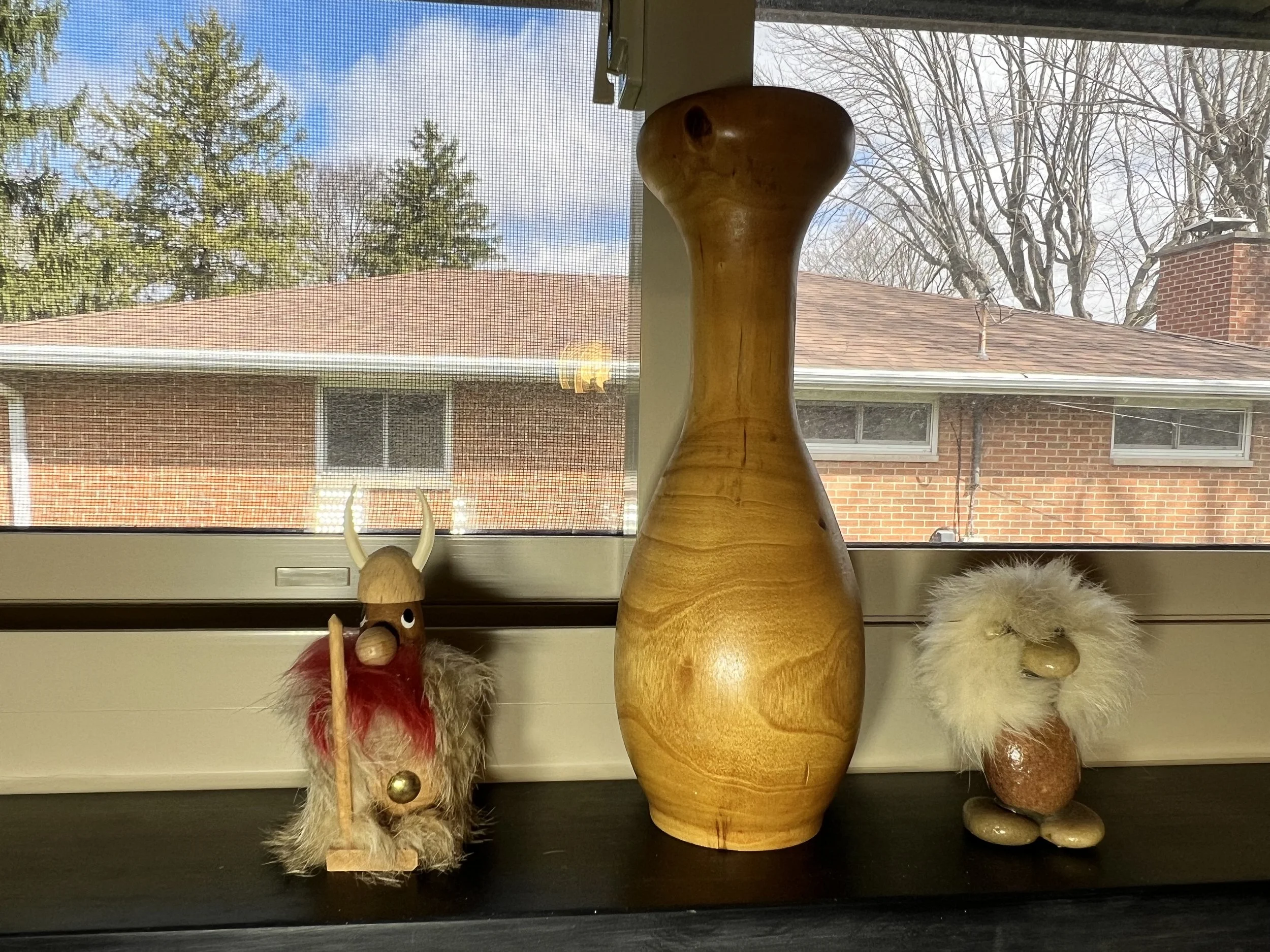 Whimsical Scandinavian wood-carved figures including a Viking and a troll