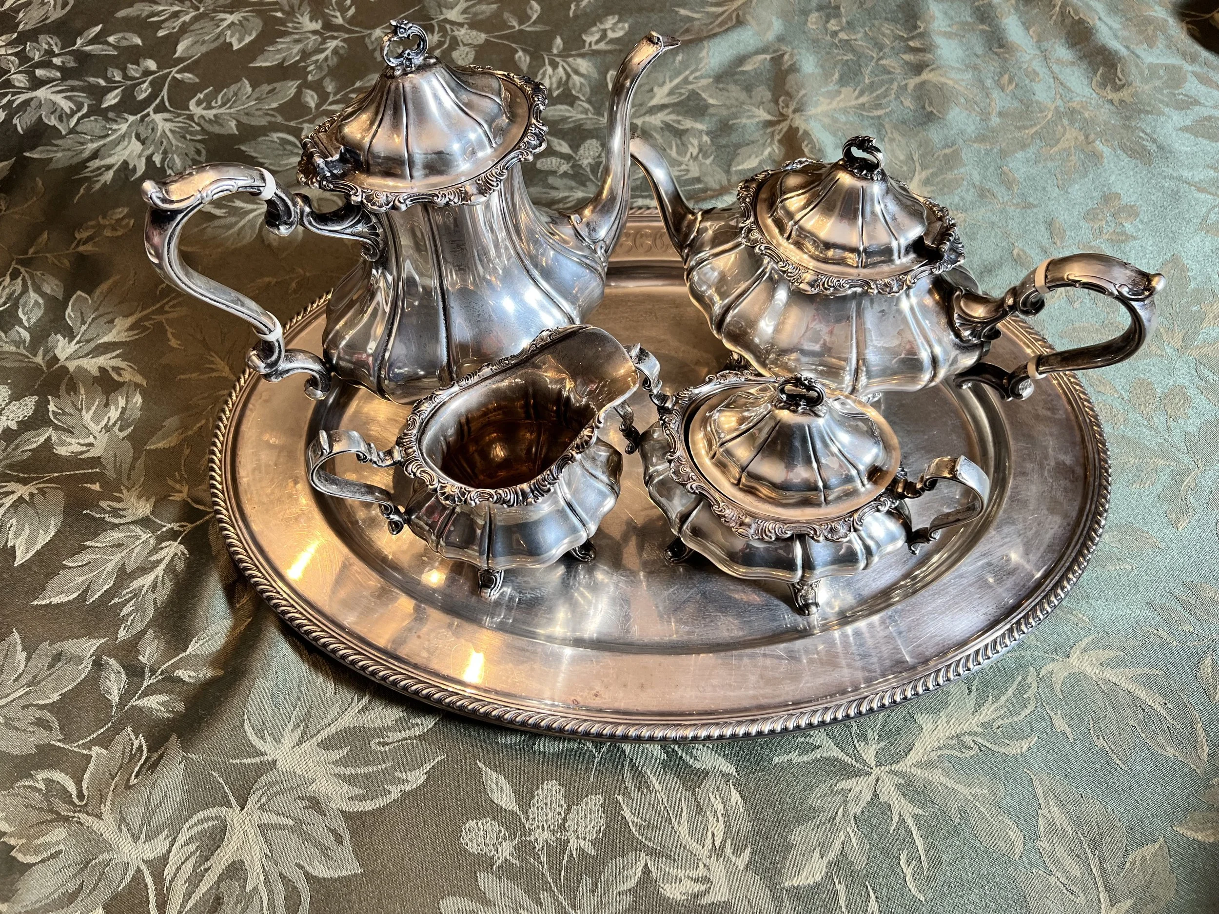 Silver Tea Service: 4-piece set including teapot, coffee pot, creamer, and sugar bowl