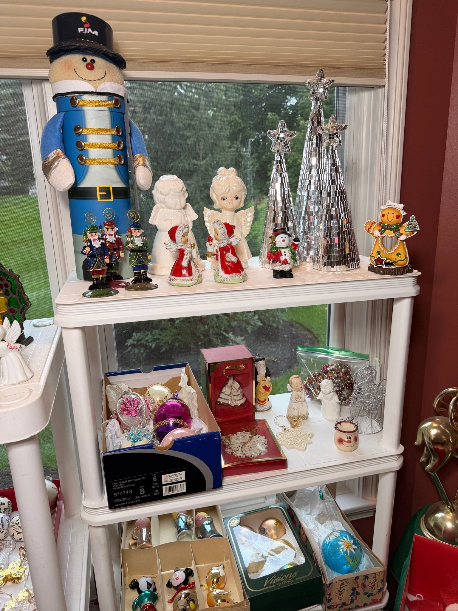 Christmas decor with large nutcracker and mirrored trees