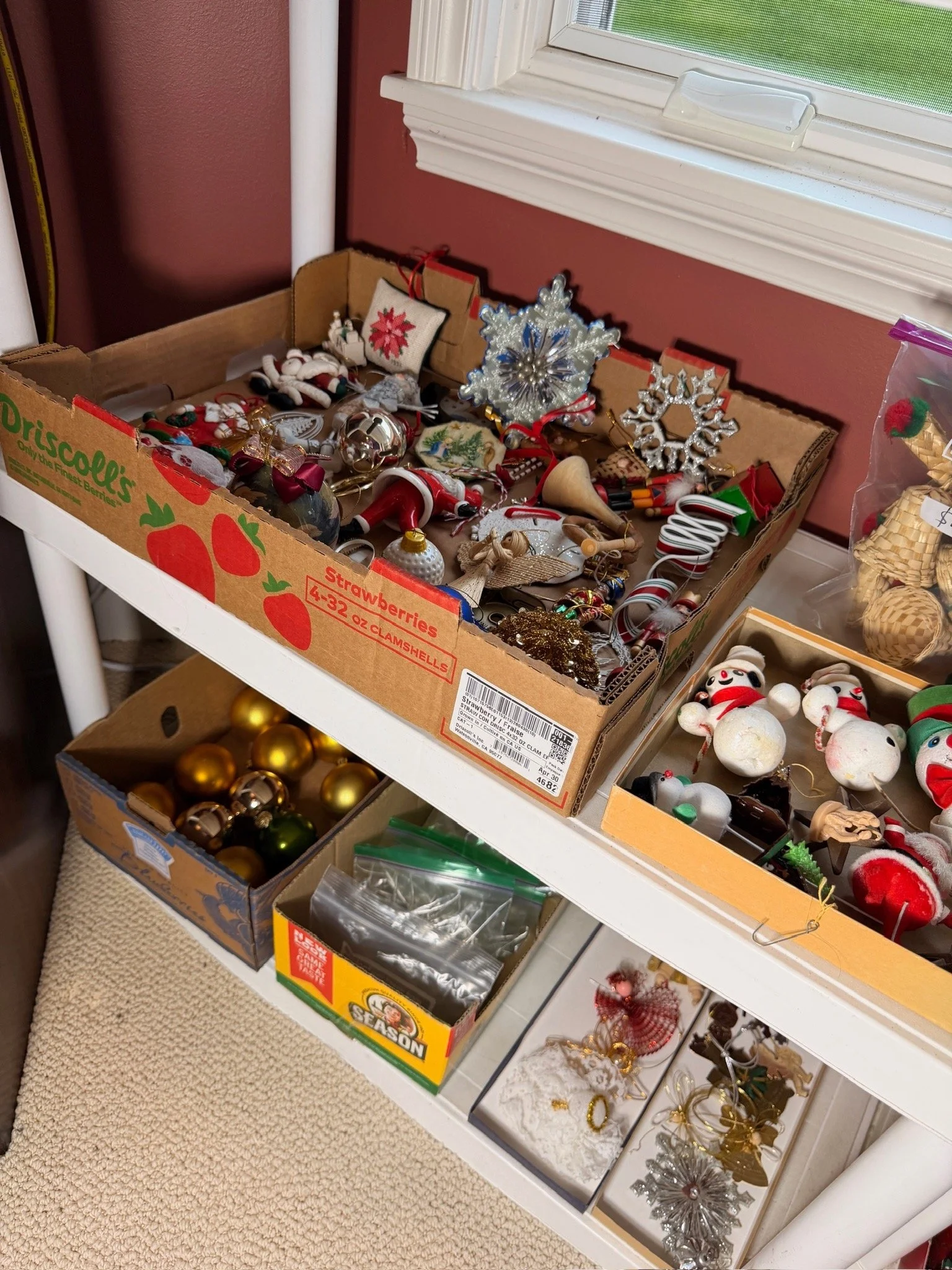 Vintage glass Christmas ornaments in storage trays