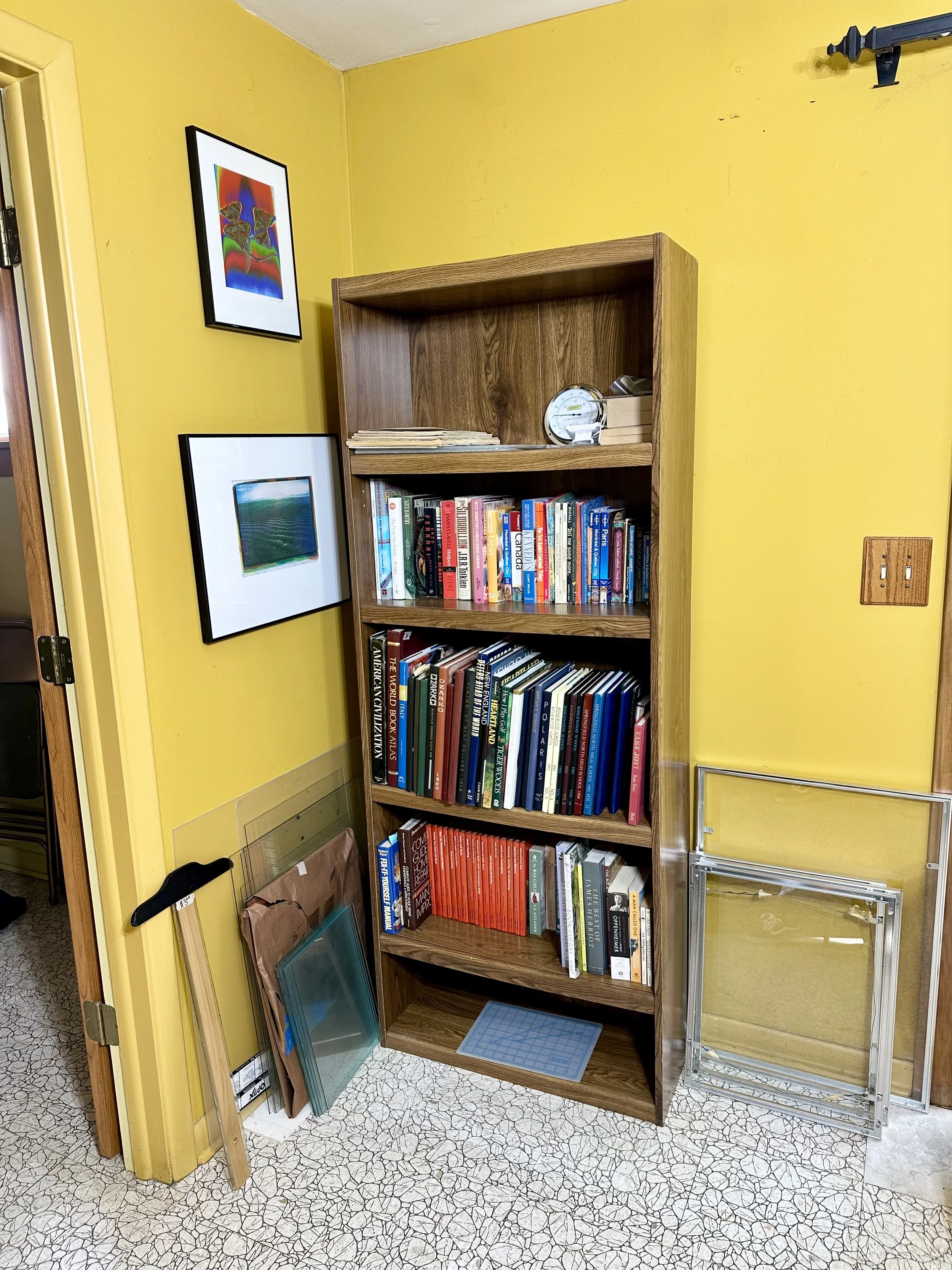 various vintage yearbooks, coffee books, and bookshelves