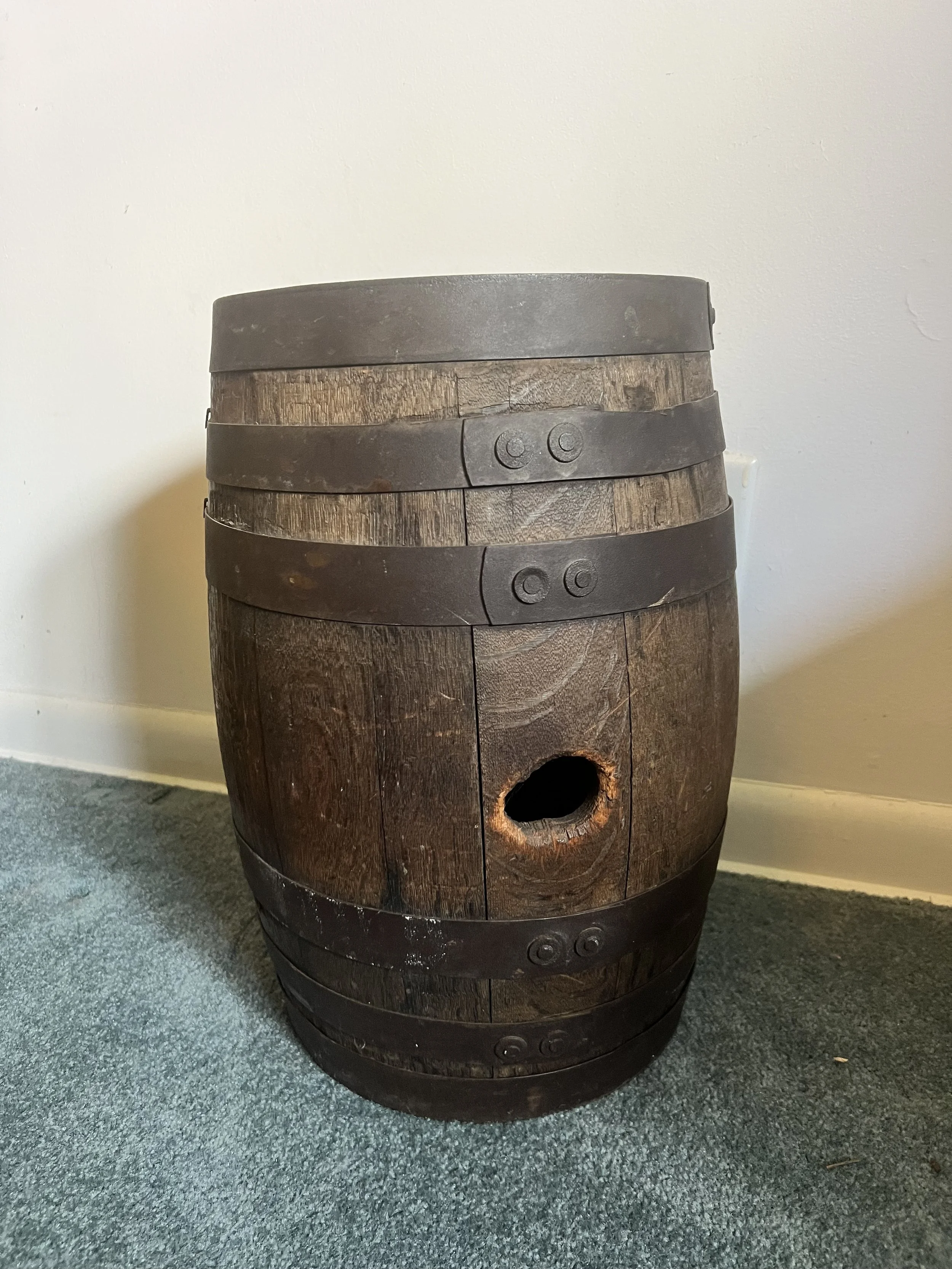 Small-scale antique wooden barrel with heavy iron straps and great rustic character