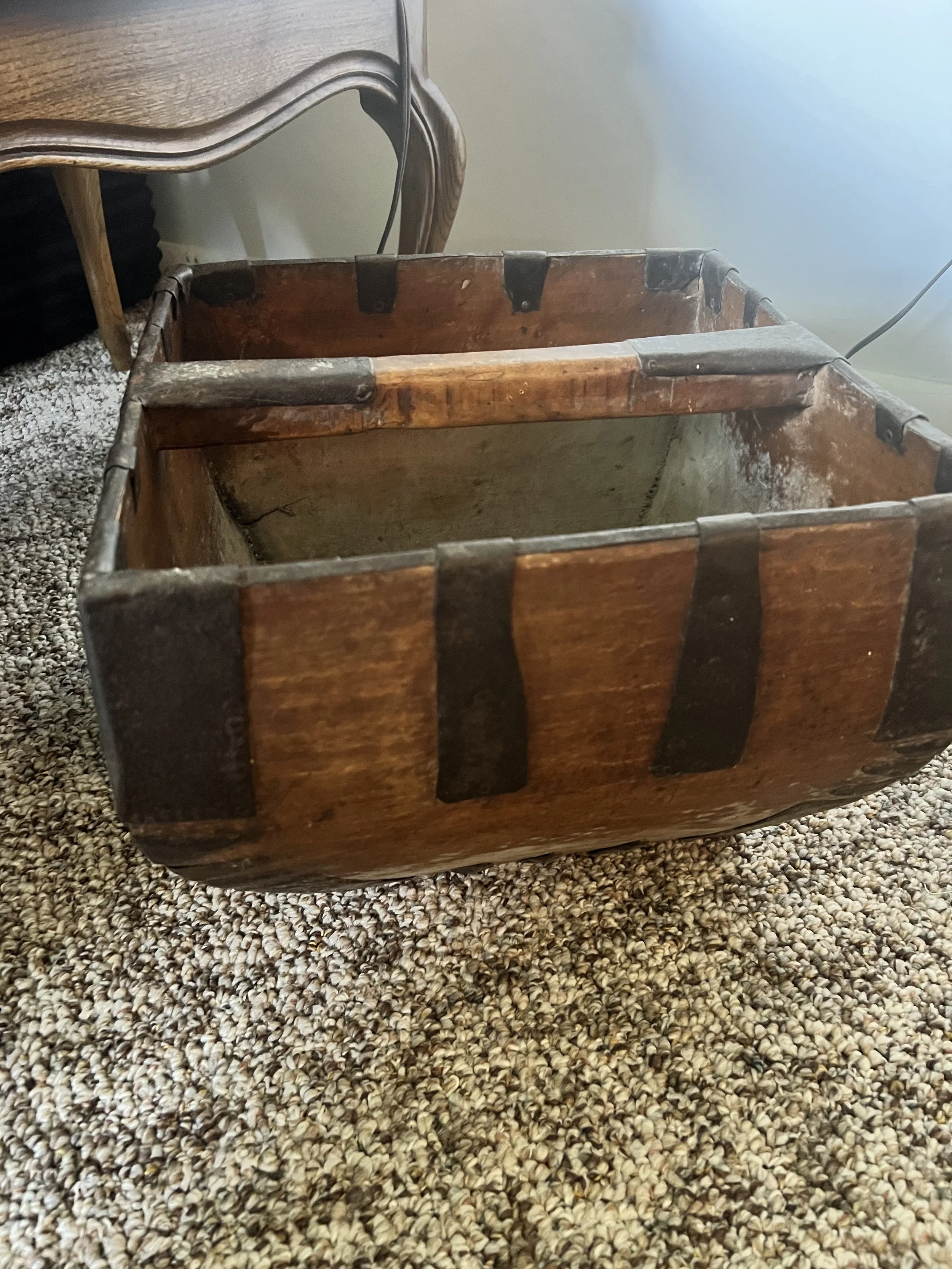 Rugged, authentic primitive wooden trough with iron banding