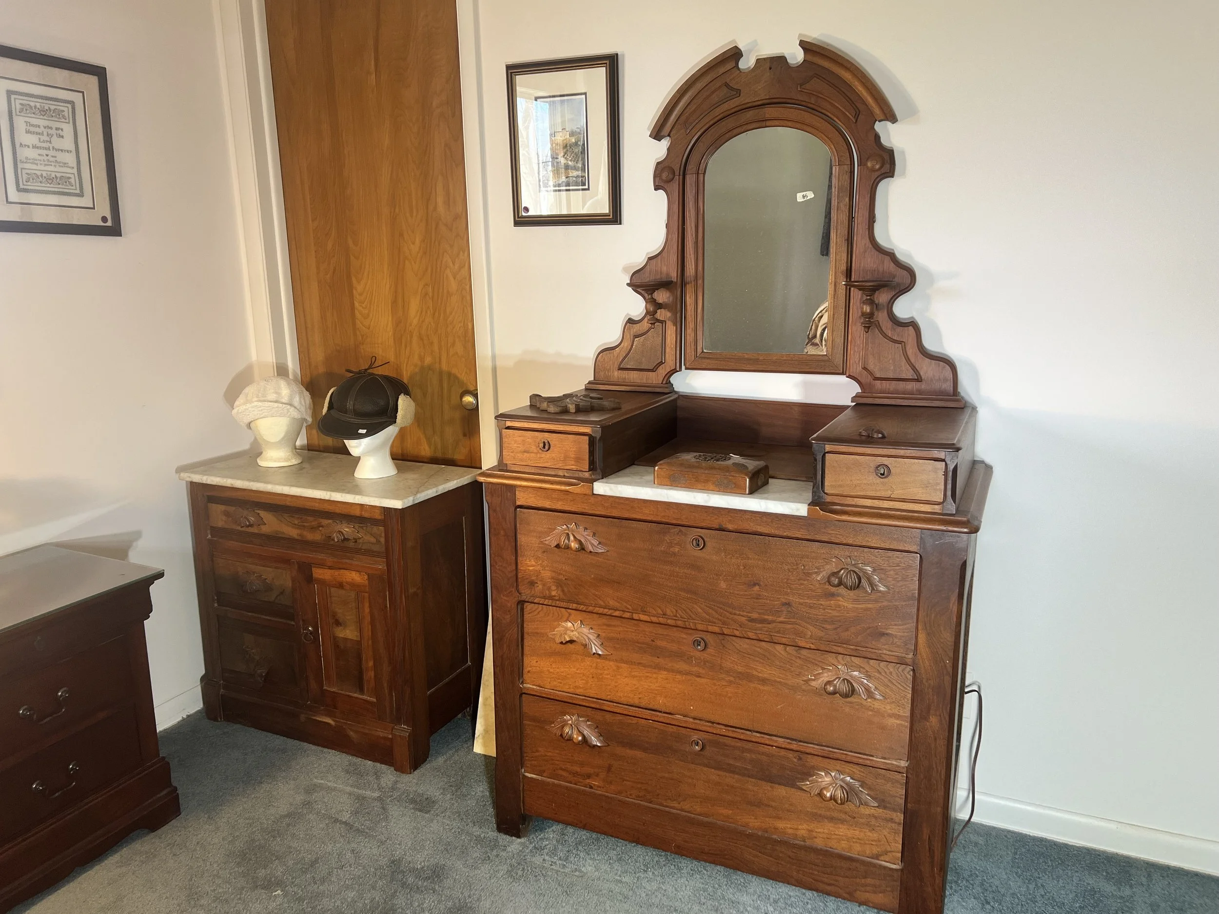Exceptional Victorian-style marble-top dresser with a massive carved mirror and glove boxes