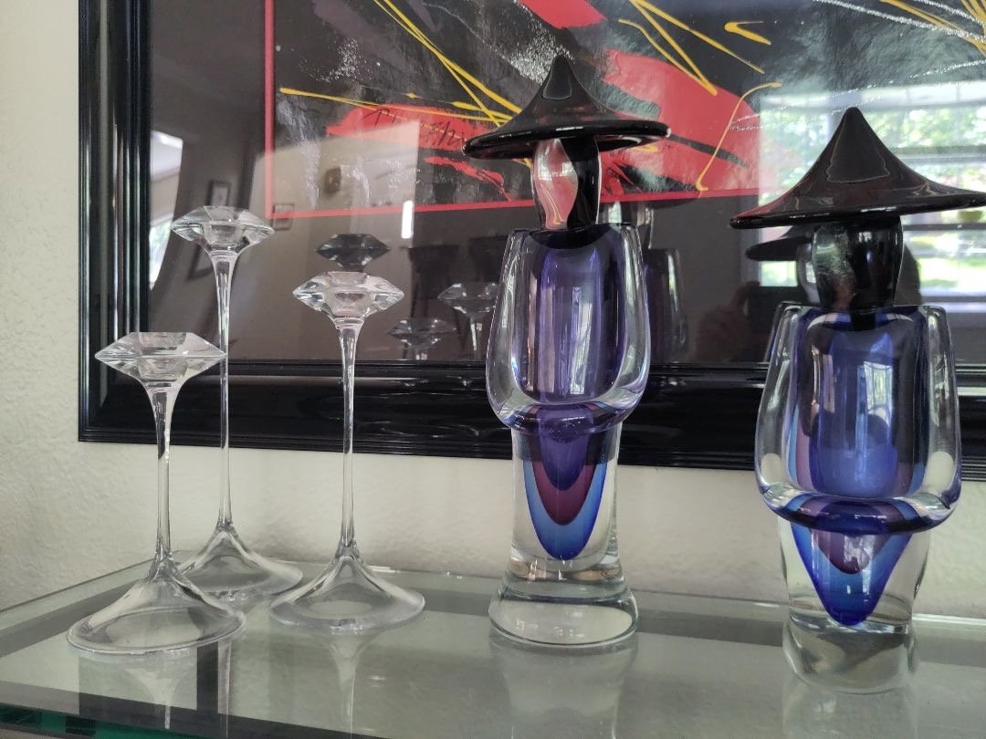 3 Kosta Boda candle holders and a pair of vintage Murano glass Asian figures signed by Luigi Onesto