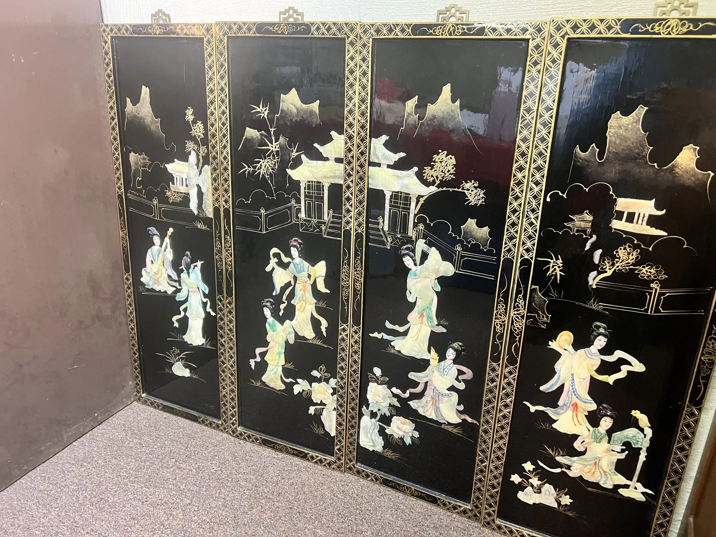 Four-panel black lacquer room divider with mother-of-pearl "shibayama" style inlay