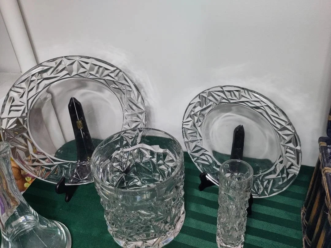 Geometric cut-crystal display pieces, featuring an Tiffany & Co. heavy ice bucket and matching plates.