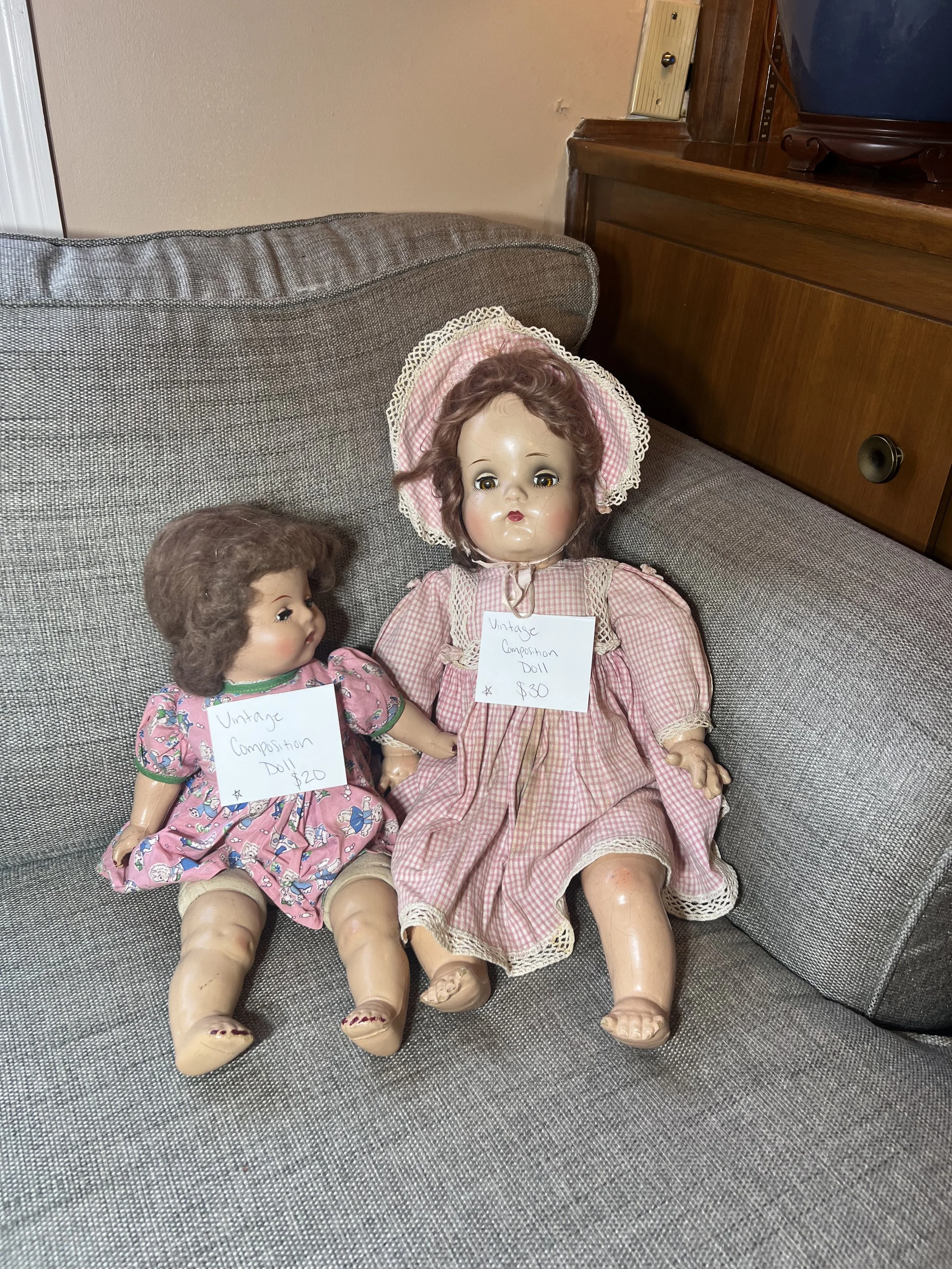 Two mid-century composition dolls with original clothing