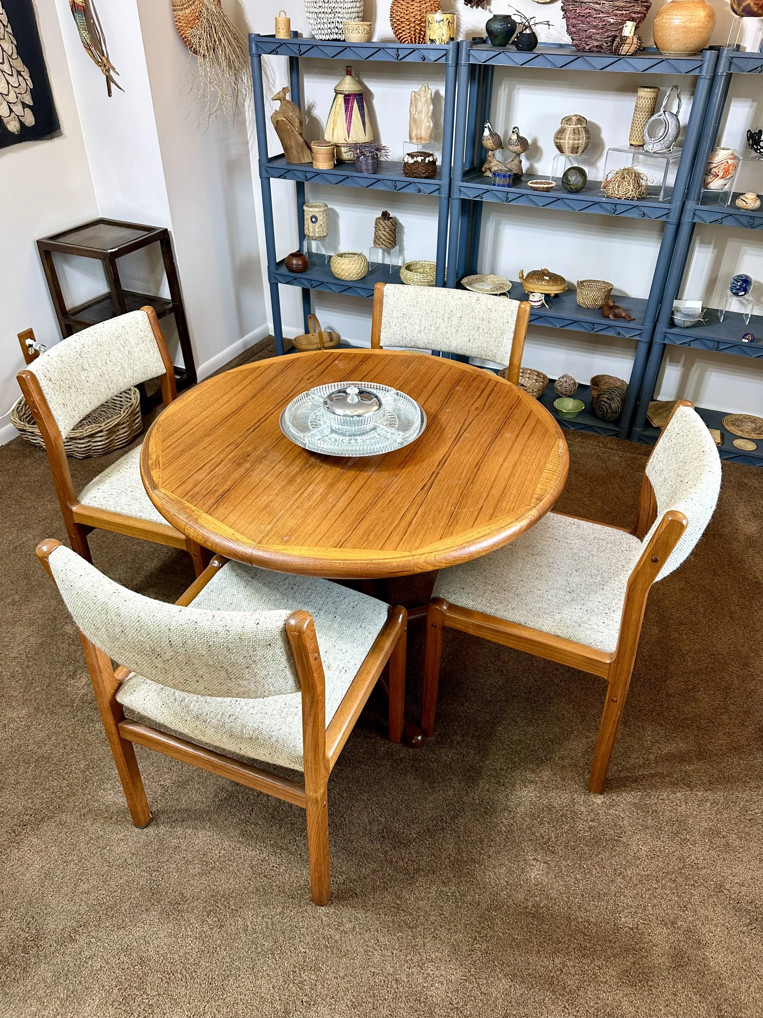 Round MCM dining room table and four fabric and wood chairs