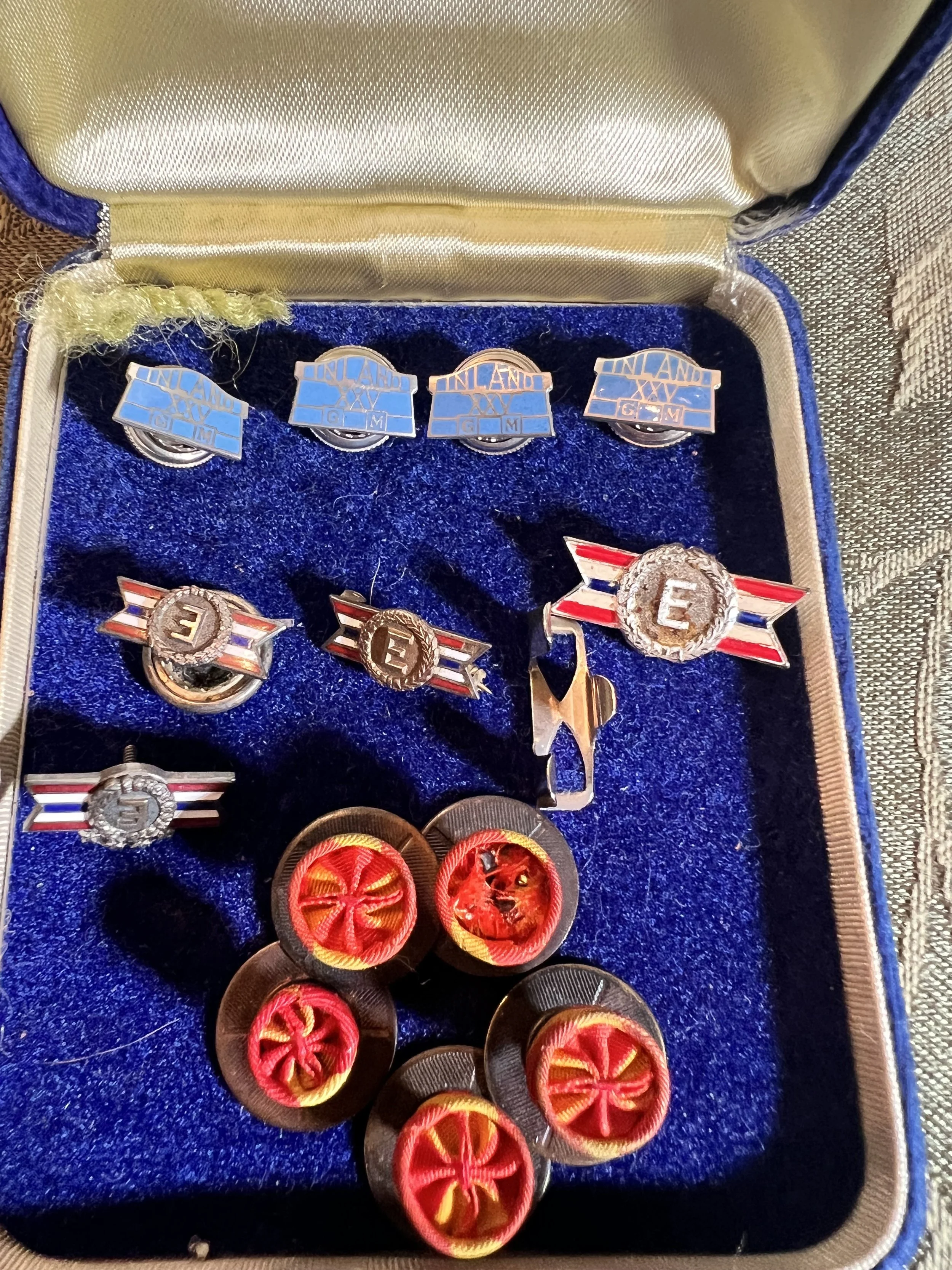 Dayton Industrial & WWII History – A rare collection of Inland GM 25-year service pins, WWII Army-Navy "E" Excellence in Production award pins, and vintage military service rosettes
