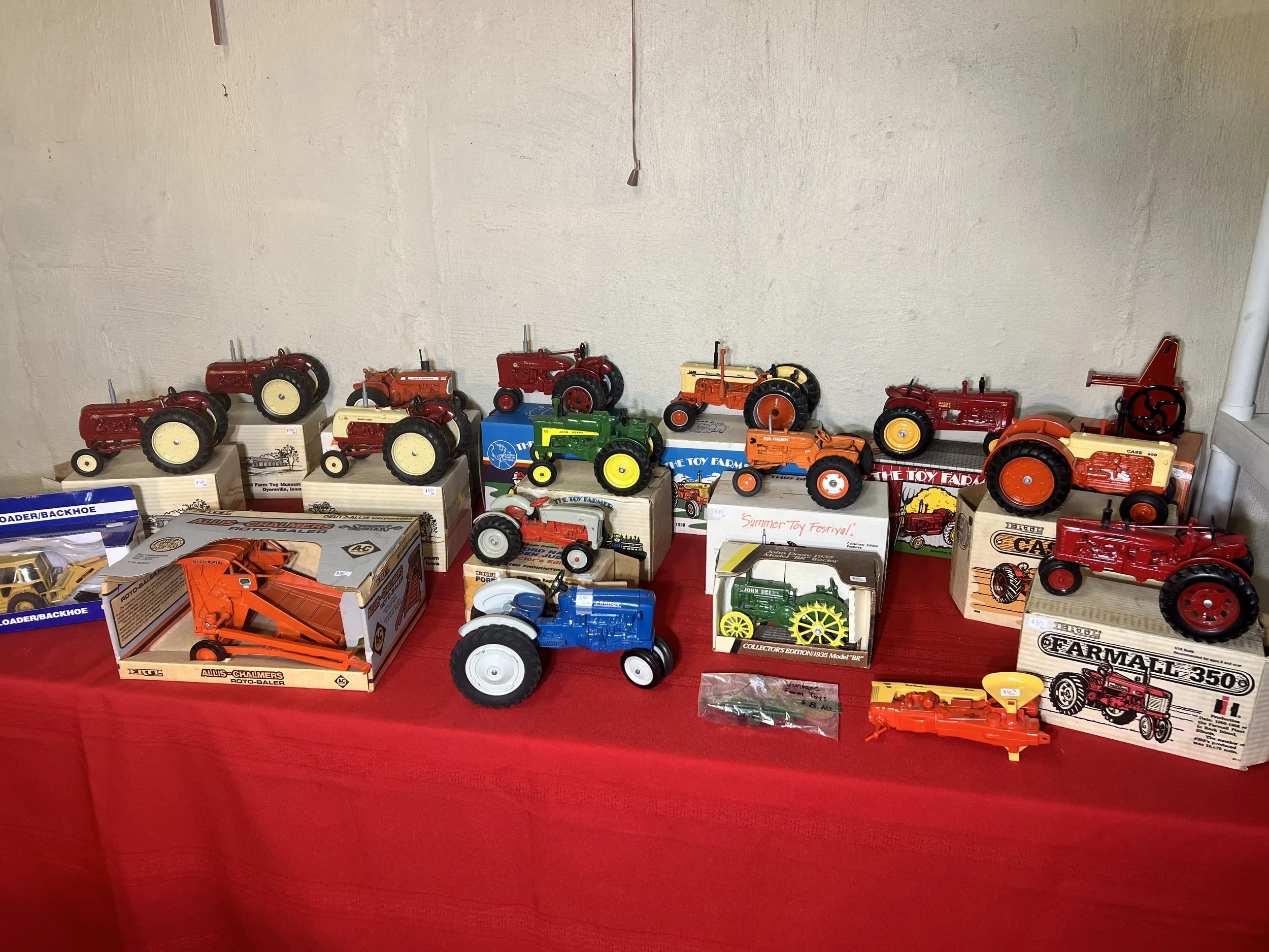 Staggering collection of Ertl farm tractors including Farmall and John Deere