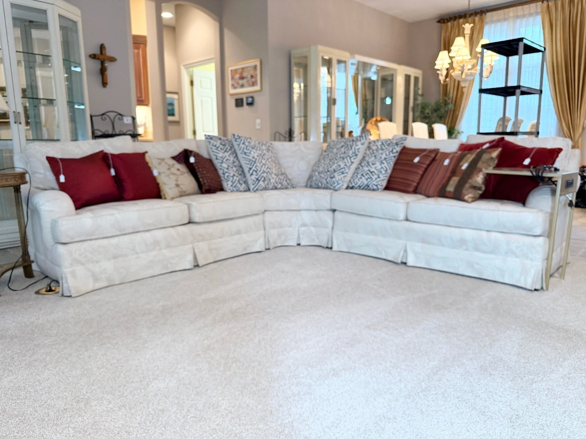 Large white multi-piece living room sectional sofa, multiple options of accent pillows
