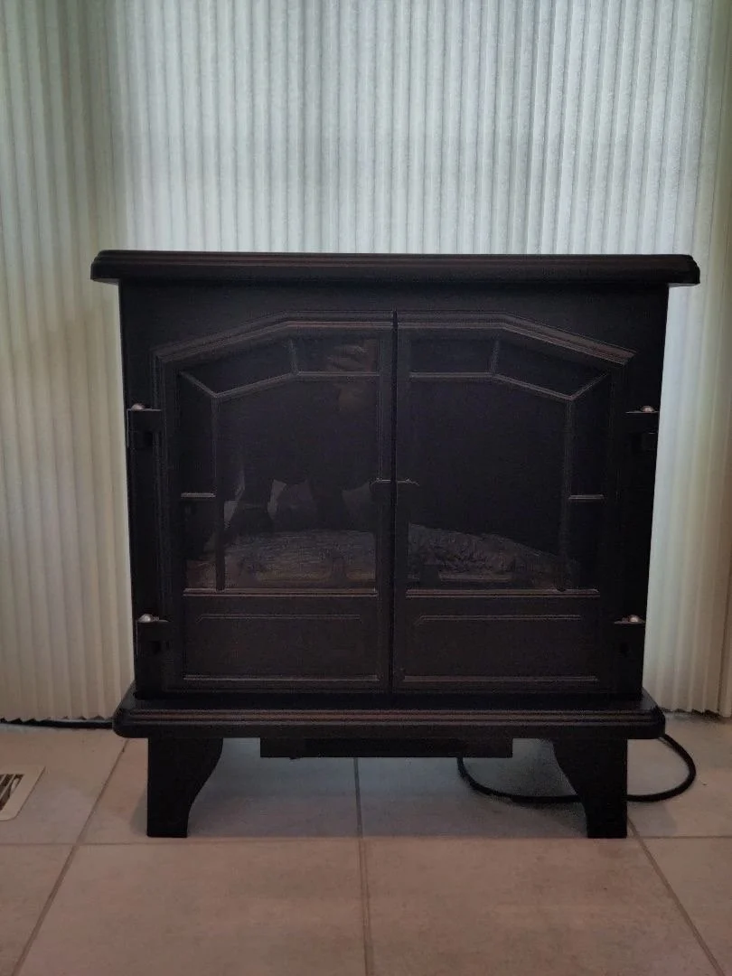 Freestanding black electric fireplace/heater unit