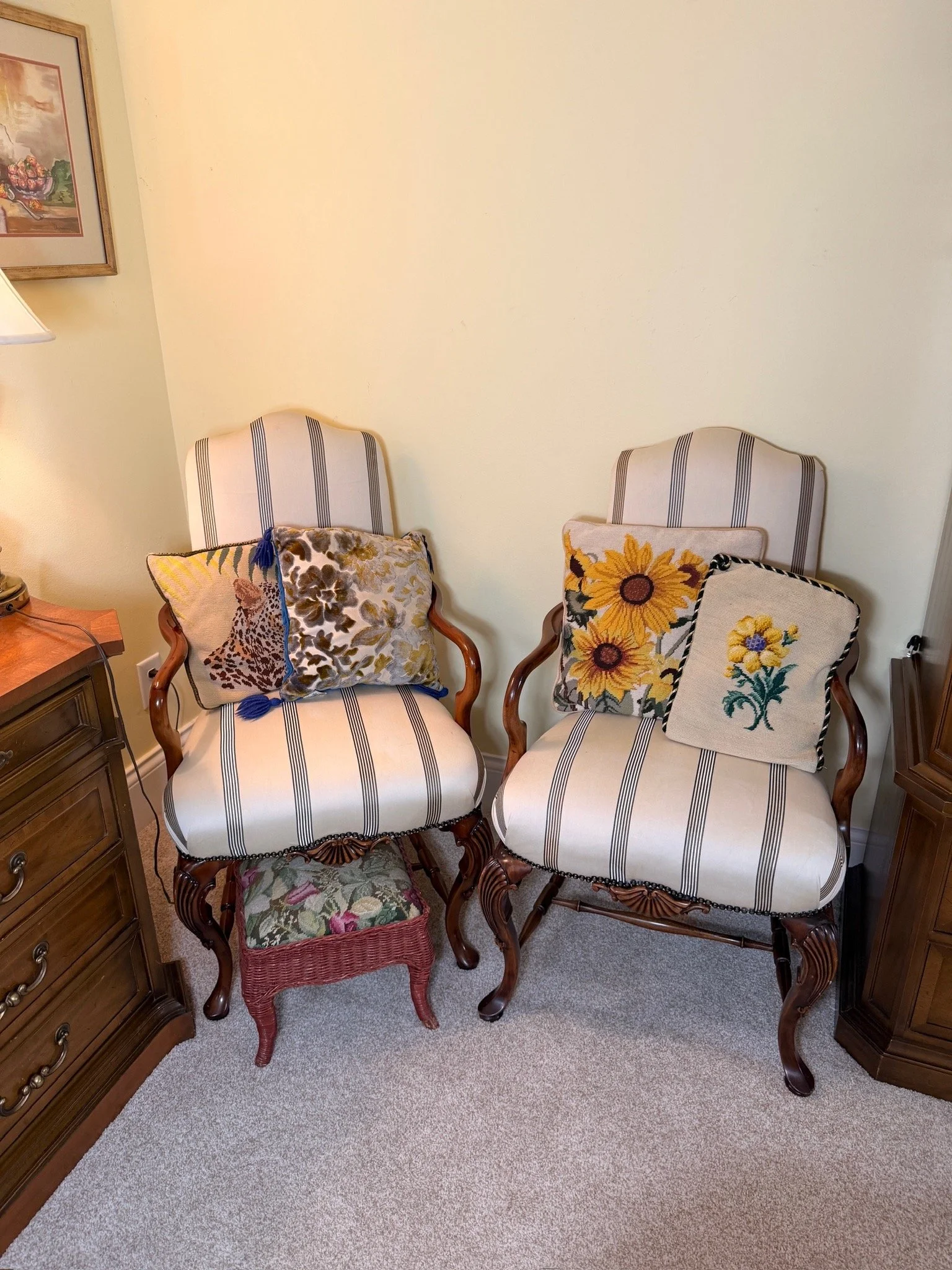 Two matching chairs and a footrest