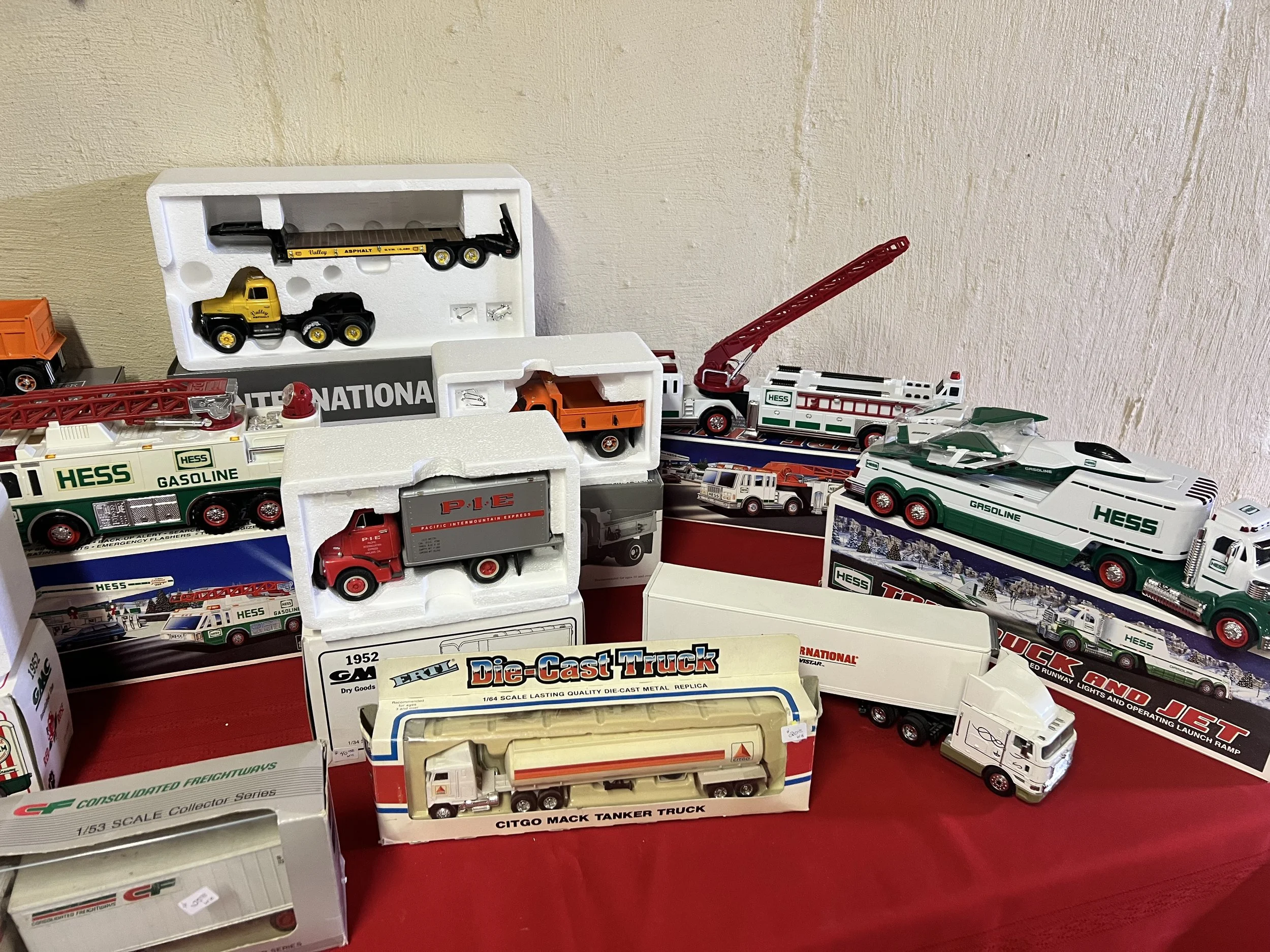 Die-Cast & Heavy Haulers – High-quality Ertl and First Gear die-cast metal replicas, featuring the Citgo Mack Tanker Truck, Consolidated Freightways "CF" tractor-trailer, and a P-I-E Pacific Intermountain Express van