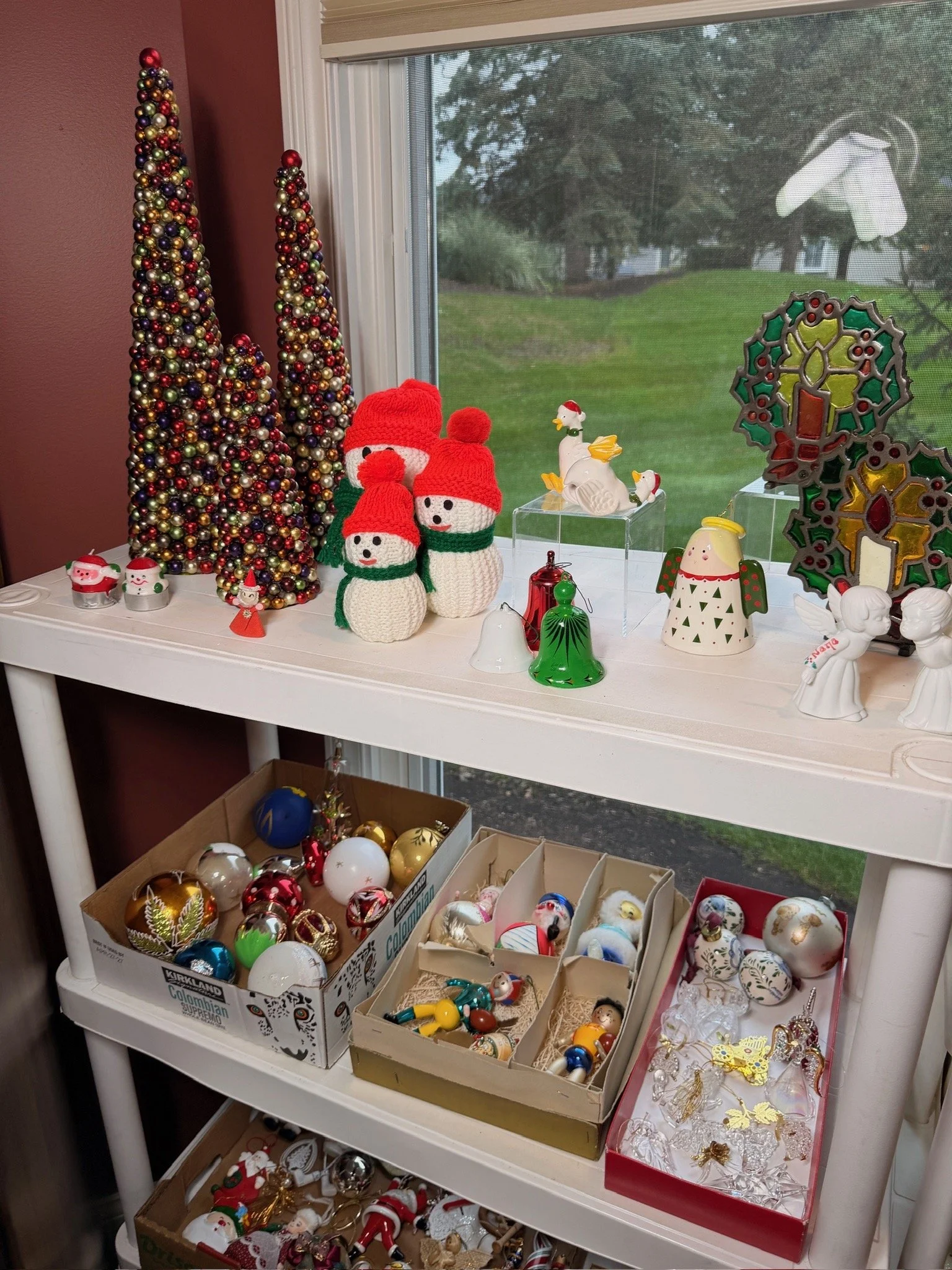 Vintage glass Christmas ornaments in storage trays