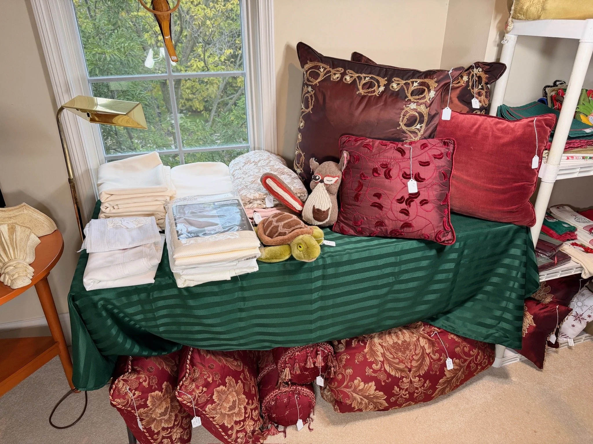 Multiple decorative pillows, linens
