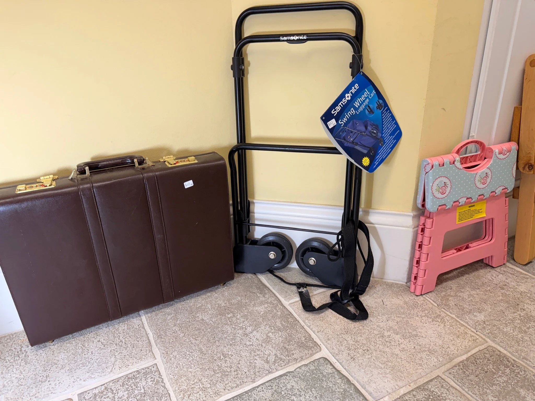Briefcase and Samsonite luggage carrier