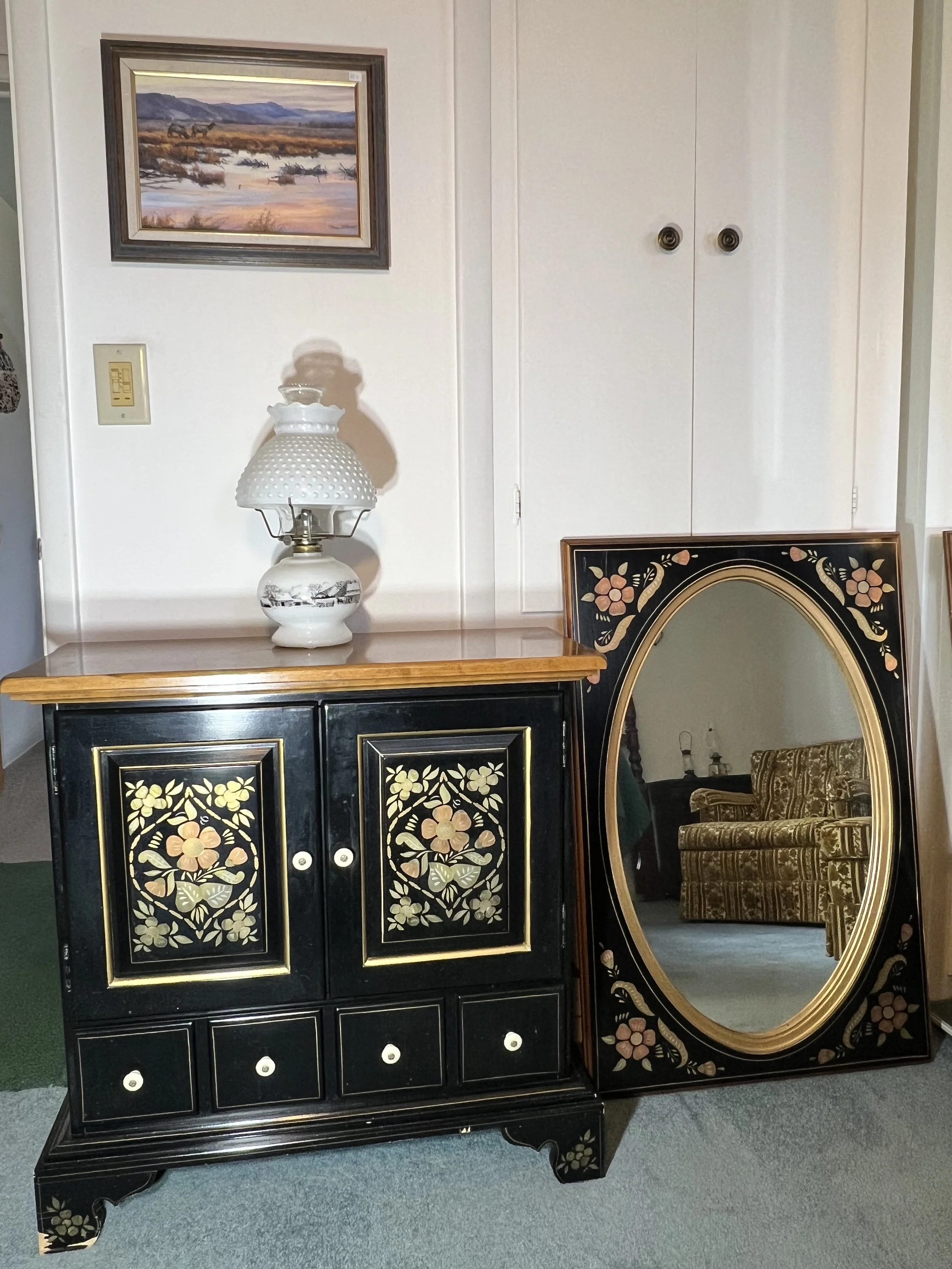 Exceptional Ethan Allen hand-painted black accent cabinet with gold floral motifs and coordinating wall mirror