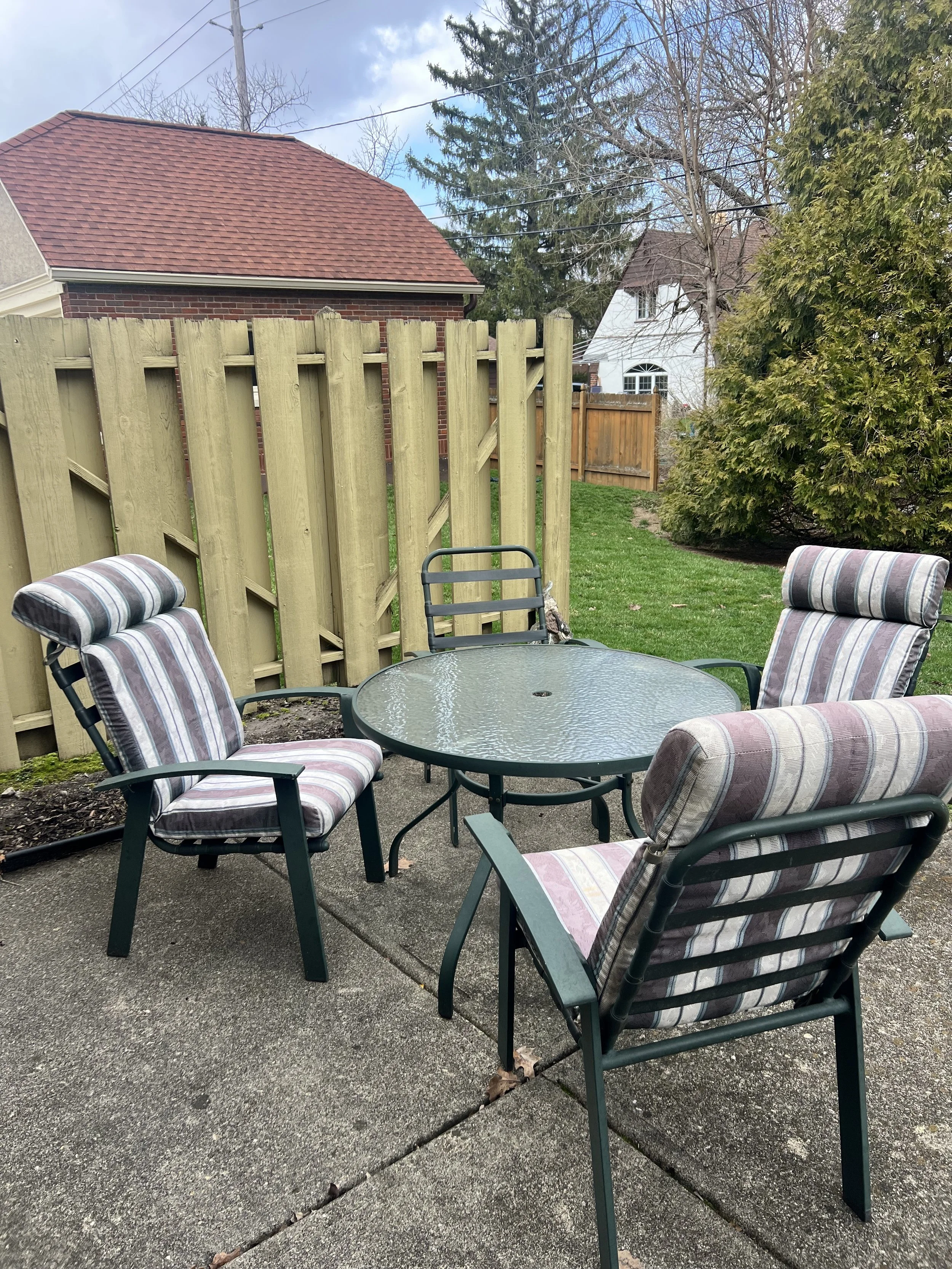 Outdoor patio furniture, table, four chairs and three chair cushions
