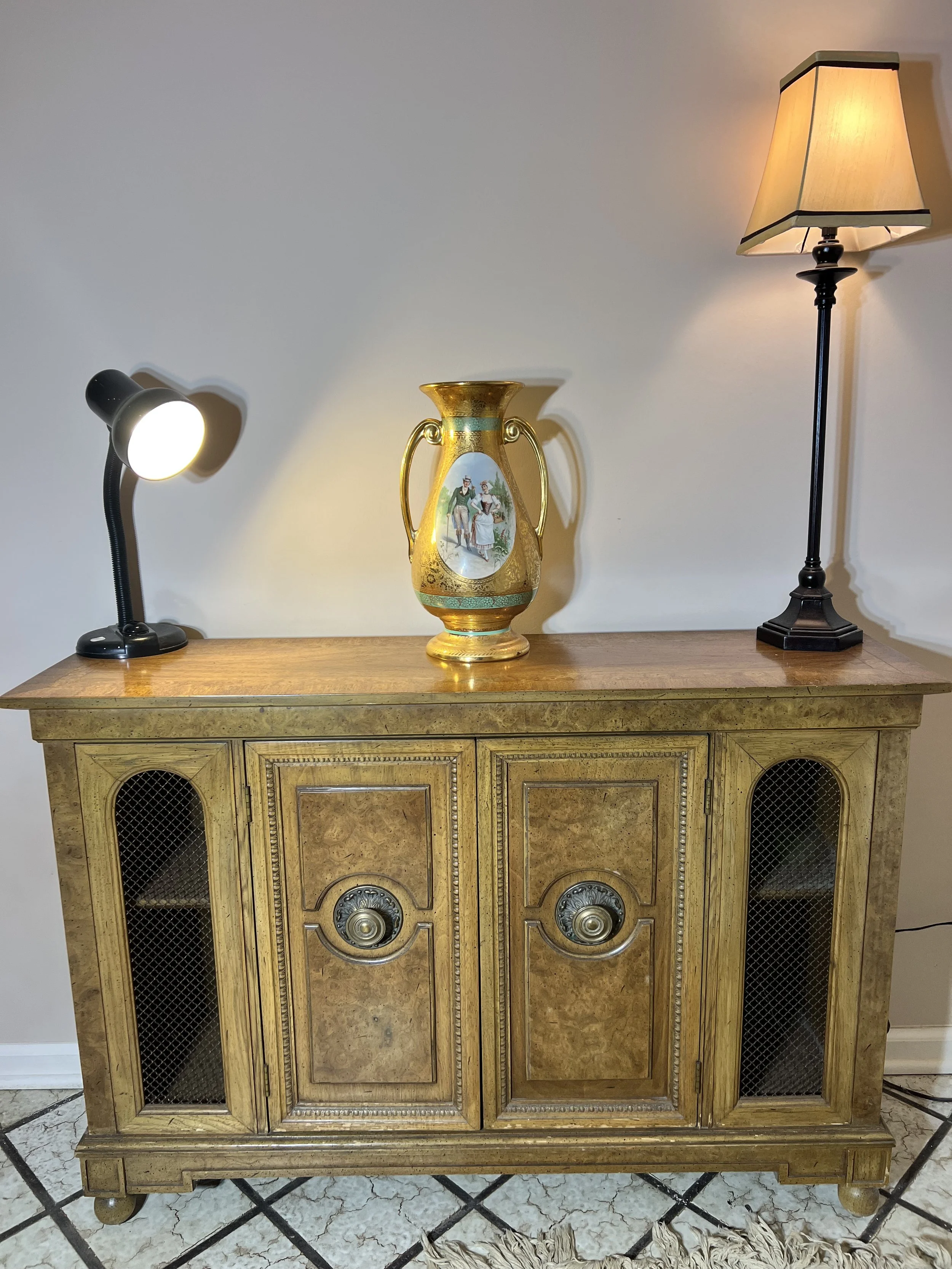 Burl wood grain buffet featuring mesh-front side doors, ornate brass hardware, and a hand-painted gold-handled urn.