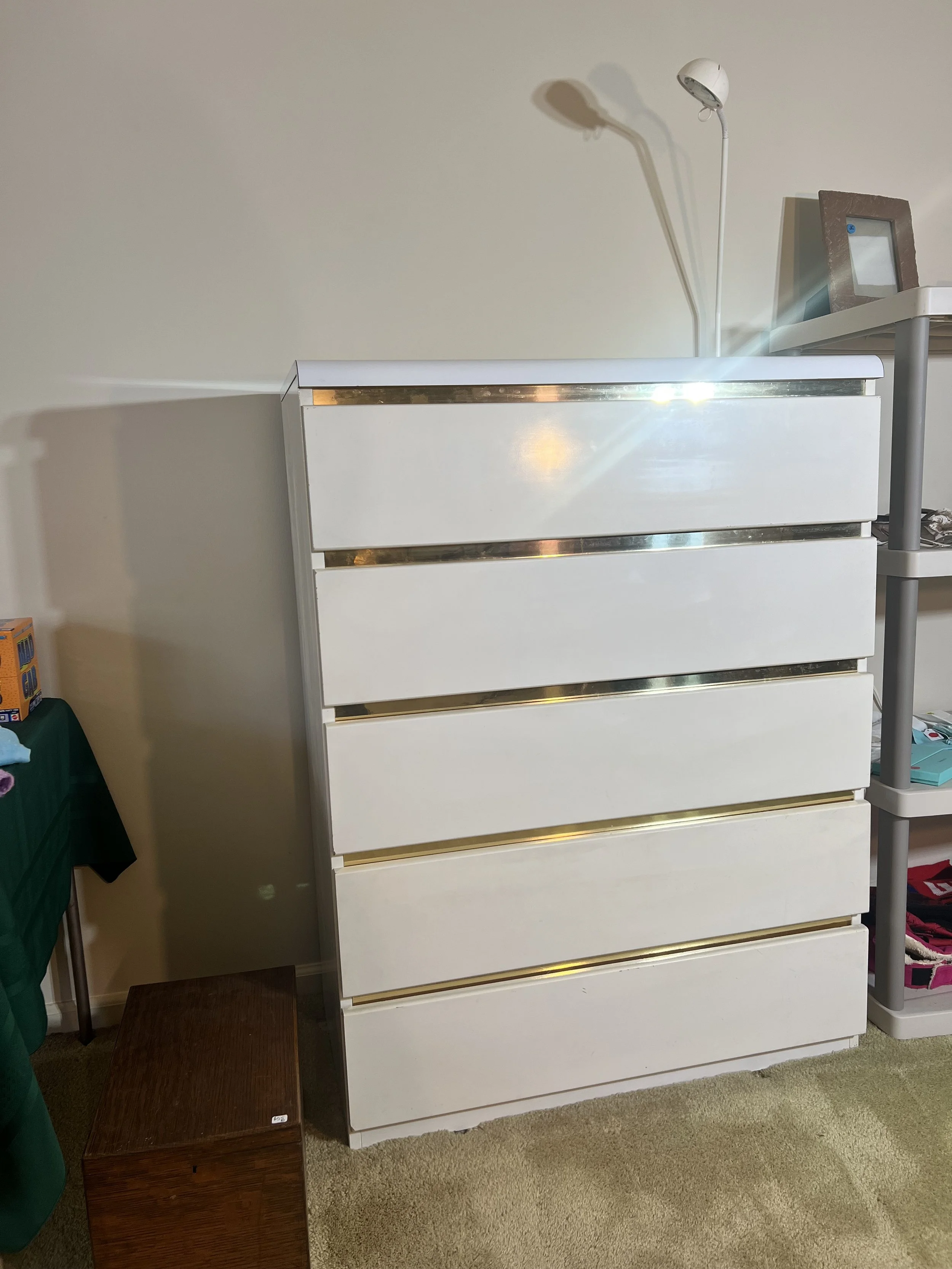 5-drawer tall dresser featuring recessed gold-tone horizontal pulls (large scratches on right side of dresser)