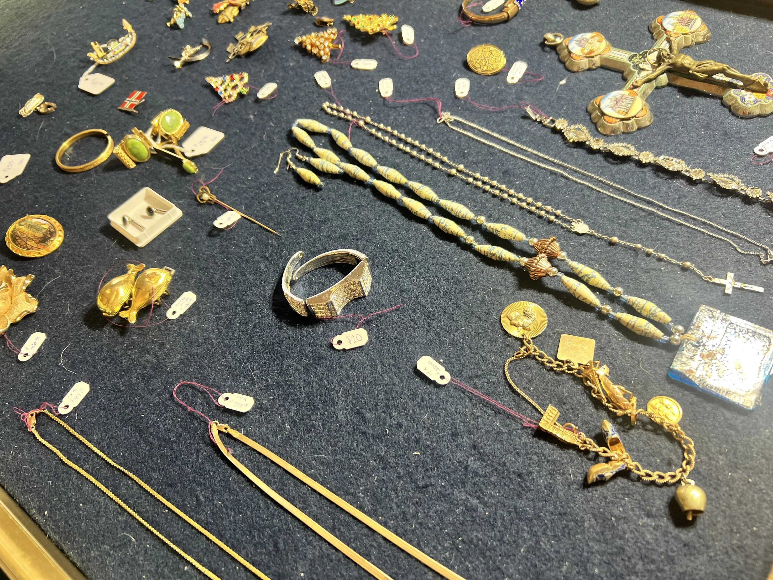 Jewelry: 14K gold chains, charms, bracelets, and vintage brooches