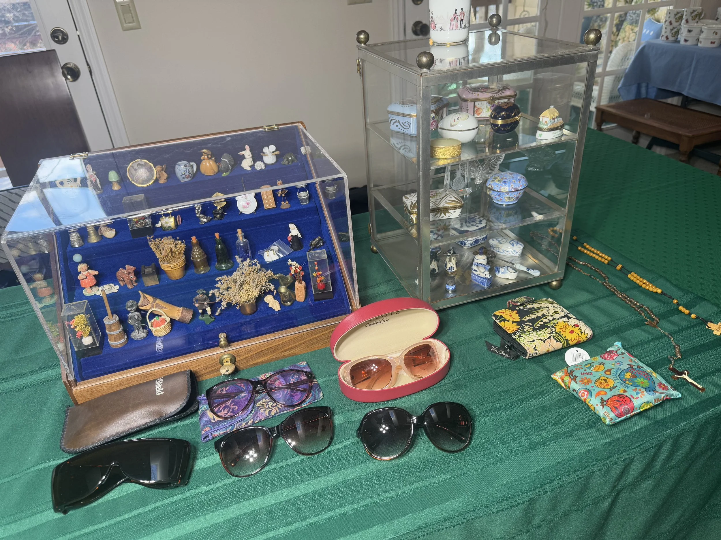various miniature figurines, vintage glasses, and more
