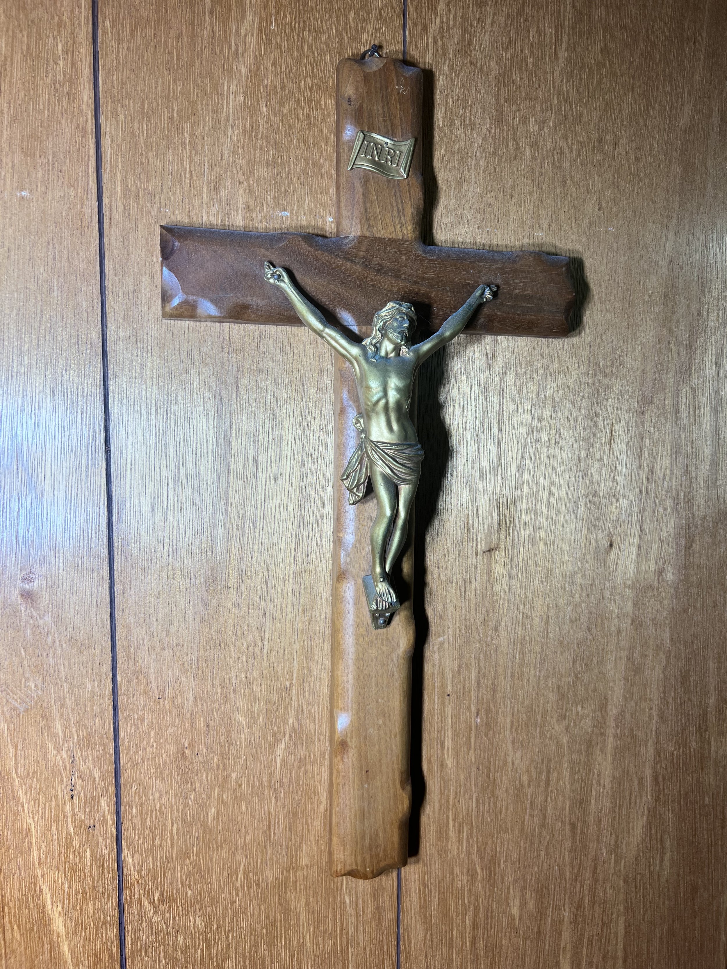 Wood wall crucifix with a detailed metal corpus of Christ