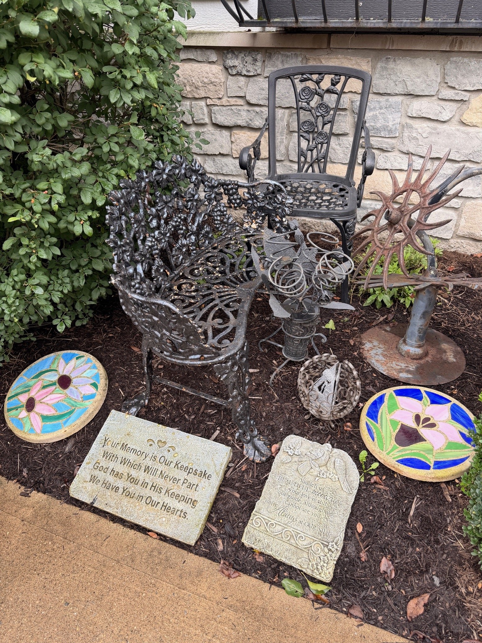 Cast iron bench, outdoor decorative stones, memorial garden stones