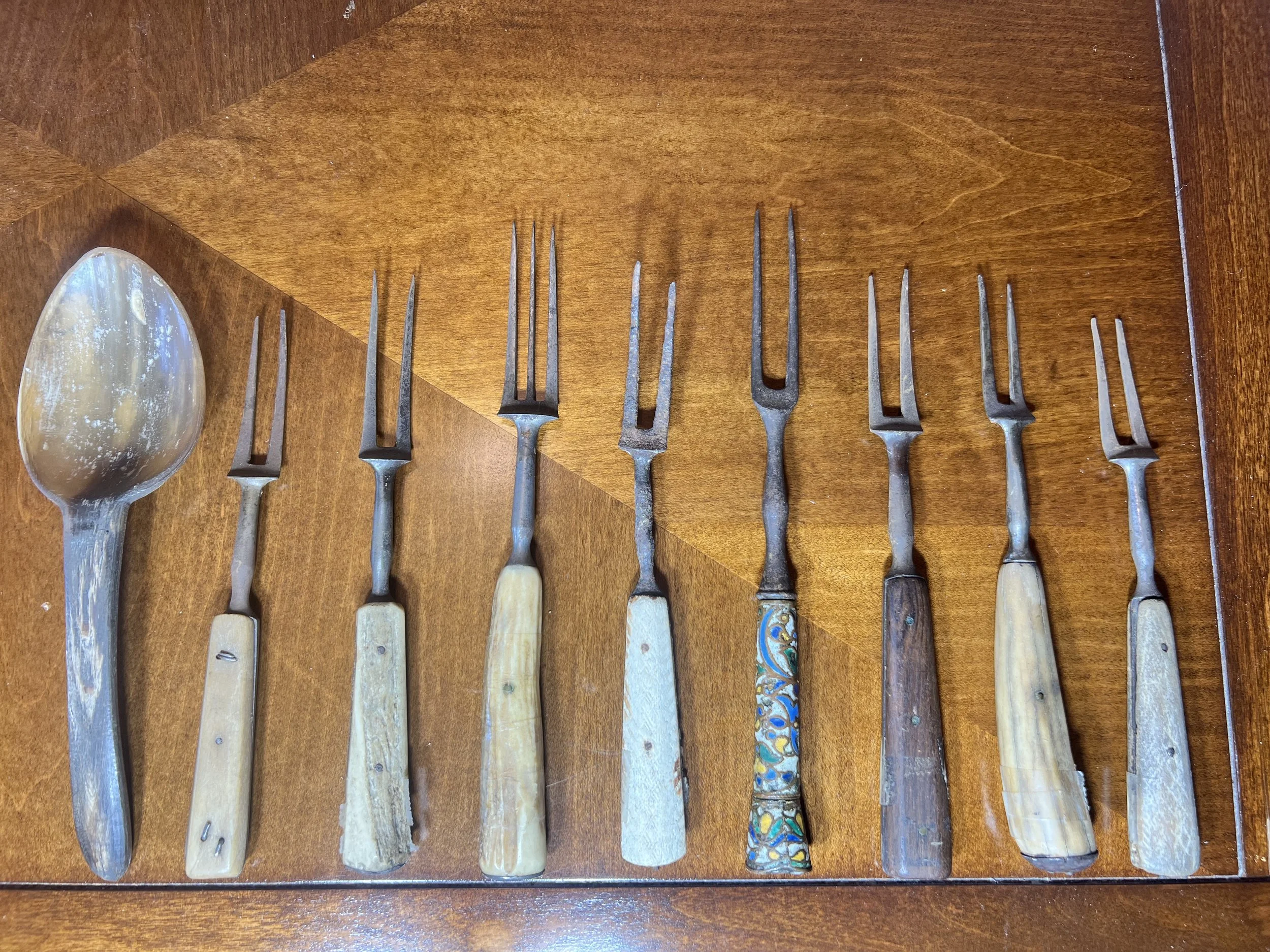 A collection of antique bone-handled forks 