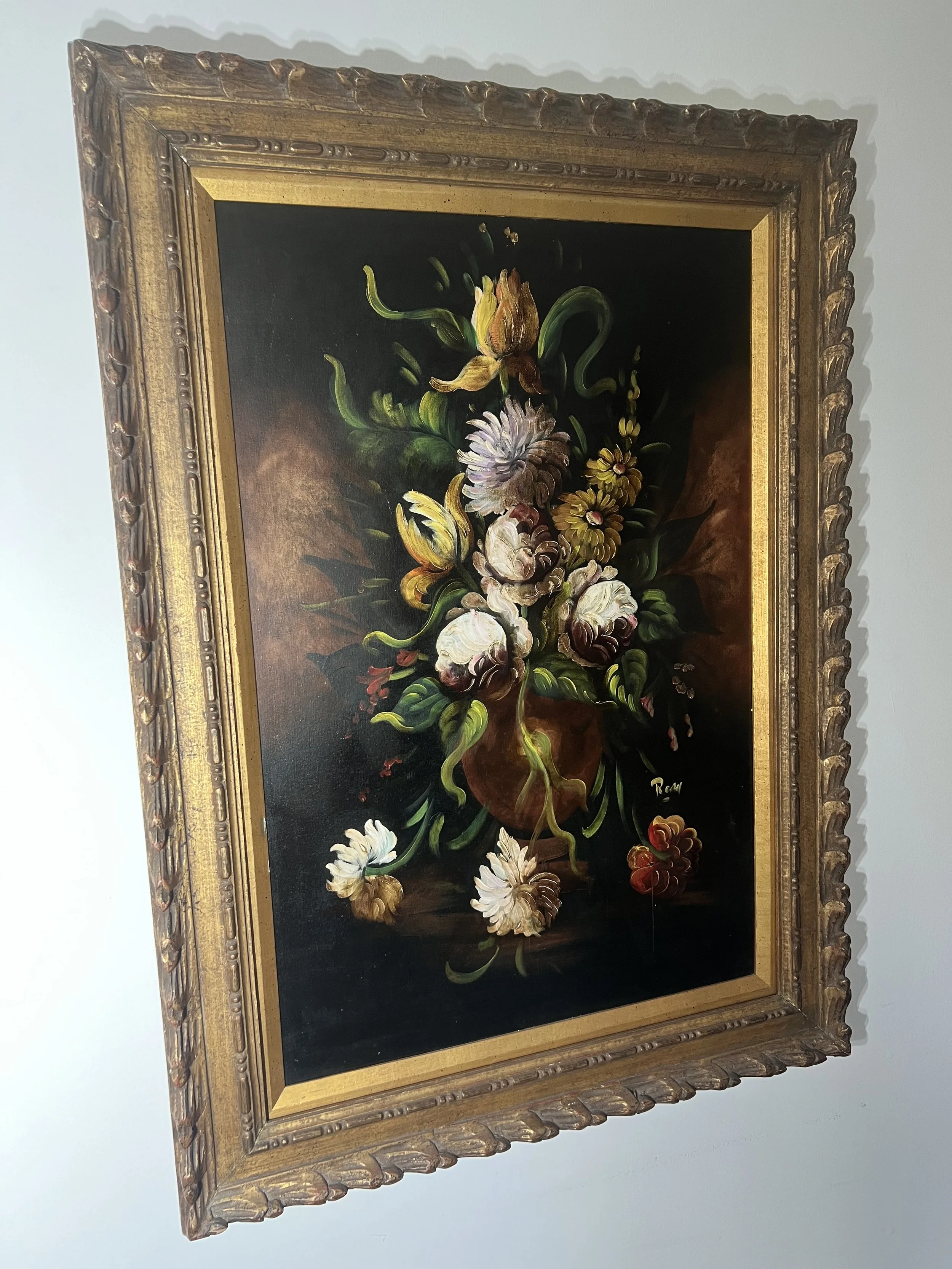 Classic floral still life oil painting in a heavy, ornate gold gilt frame