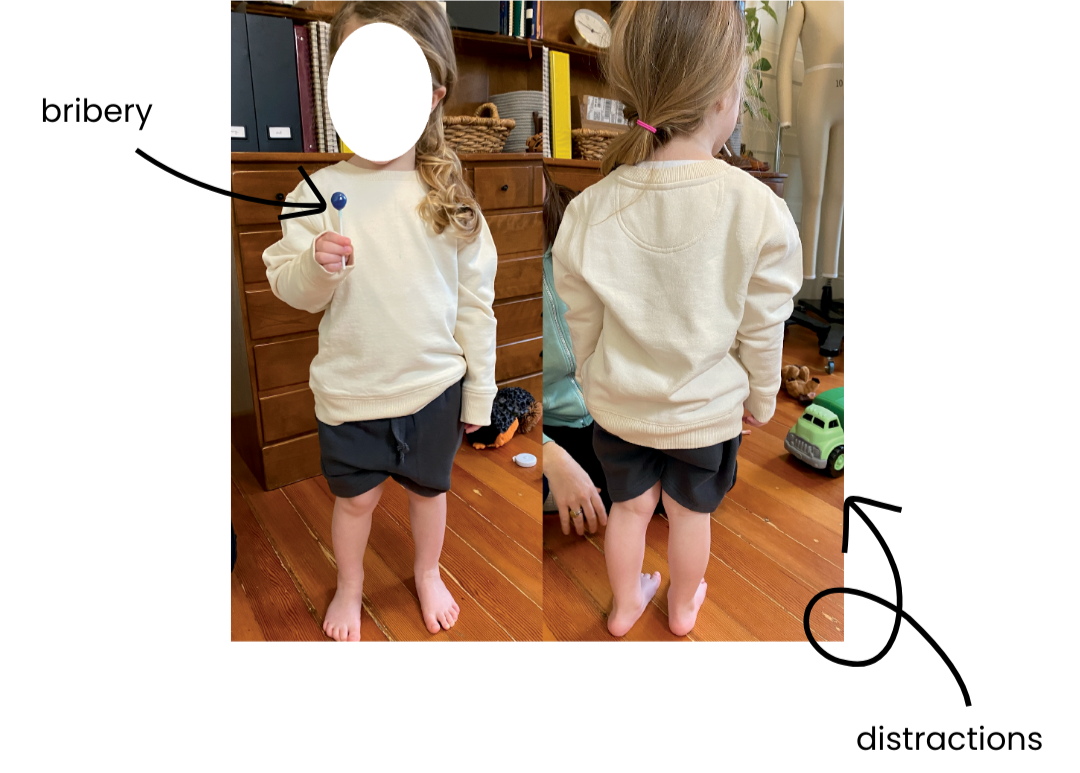 girl with lollipop wearing clothing for a fit session