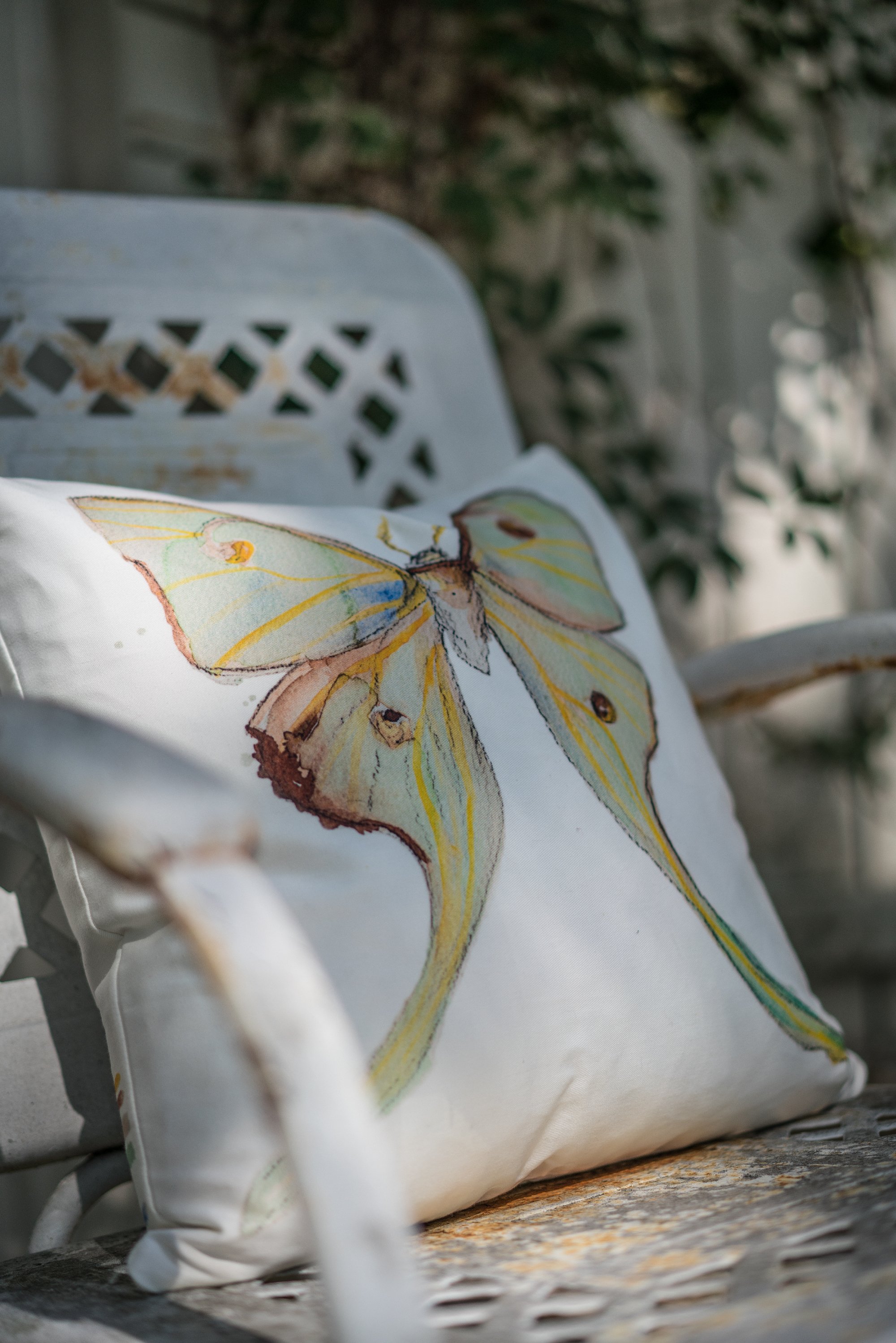 Luna Pillow on white metal chair.jpg