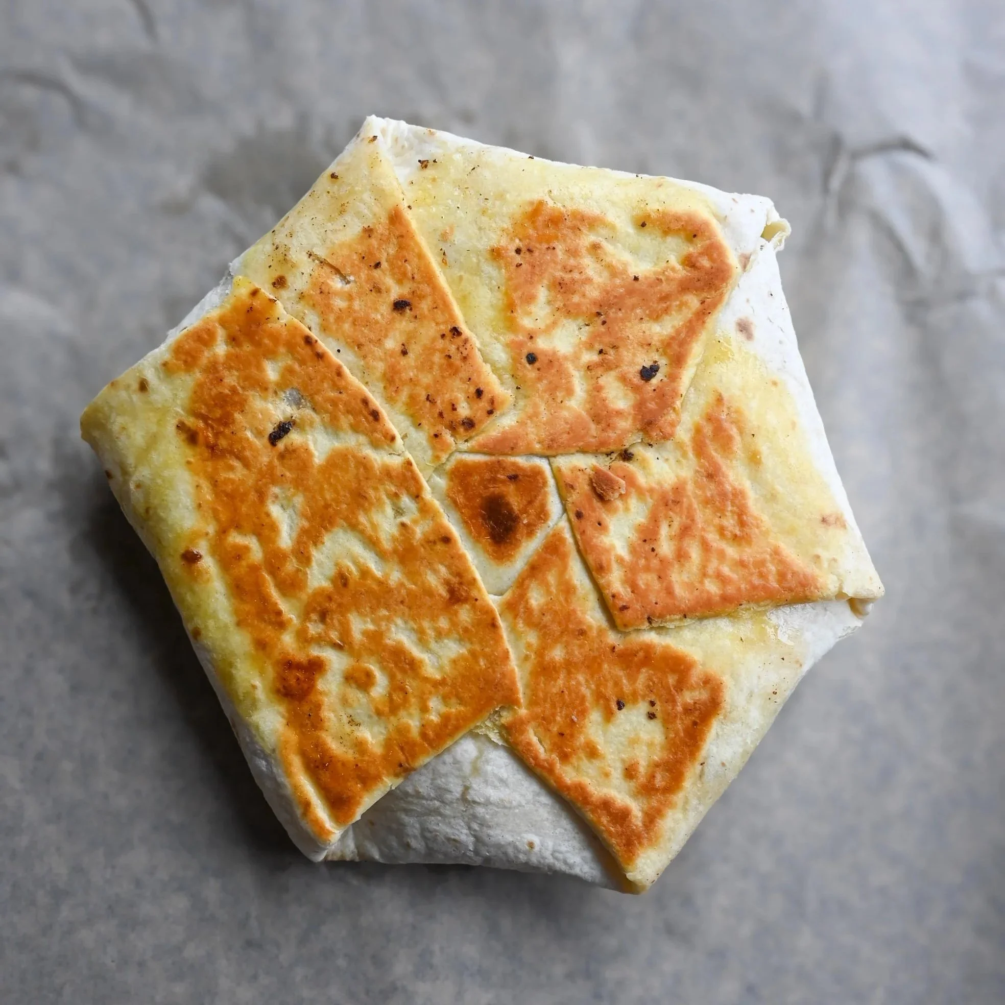 Pub version of a crunch wrap supreme made in milwaukee on special on wednesdays