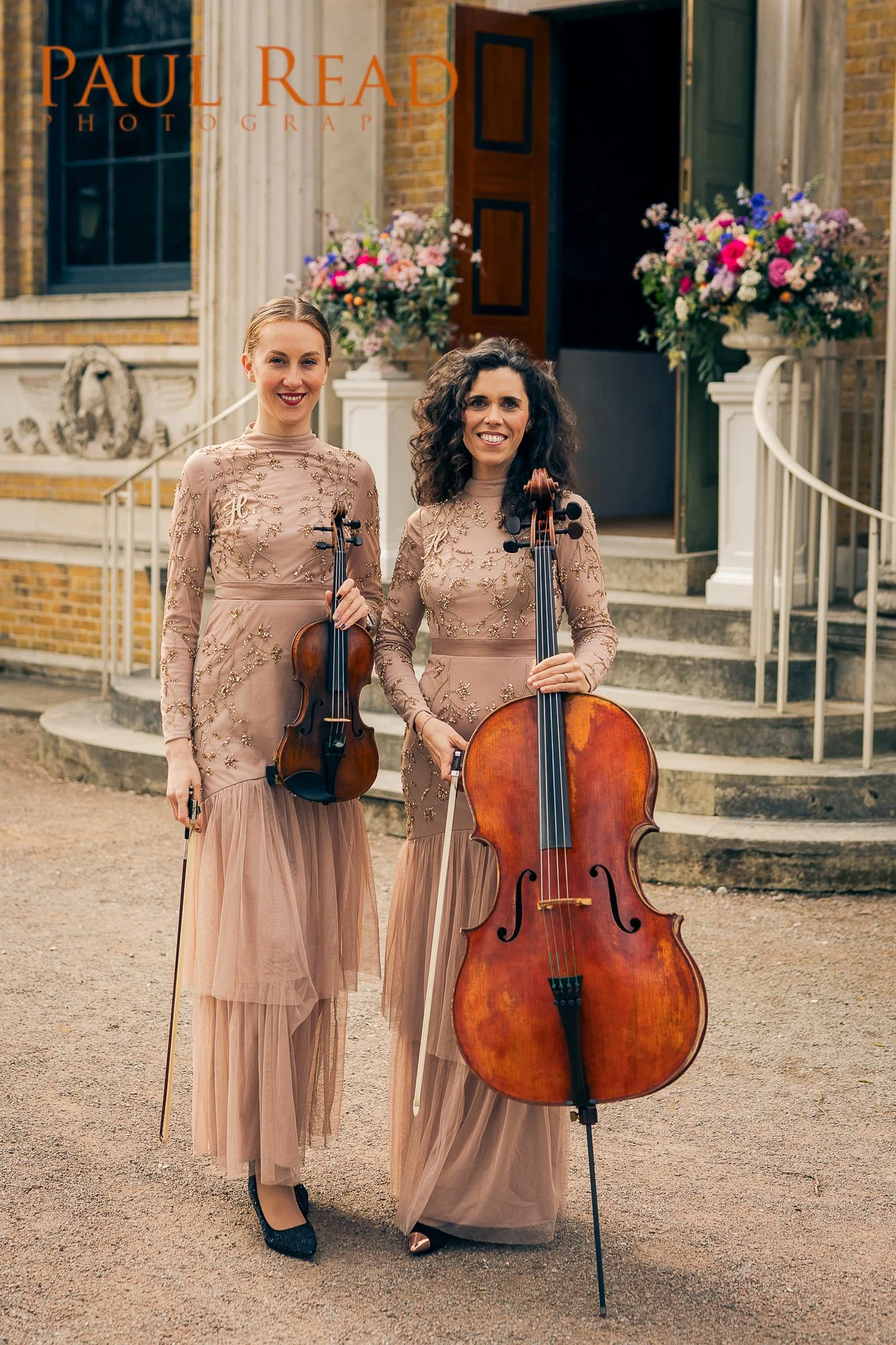 String duo performing violin and cello music for a wedding