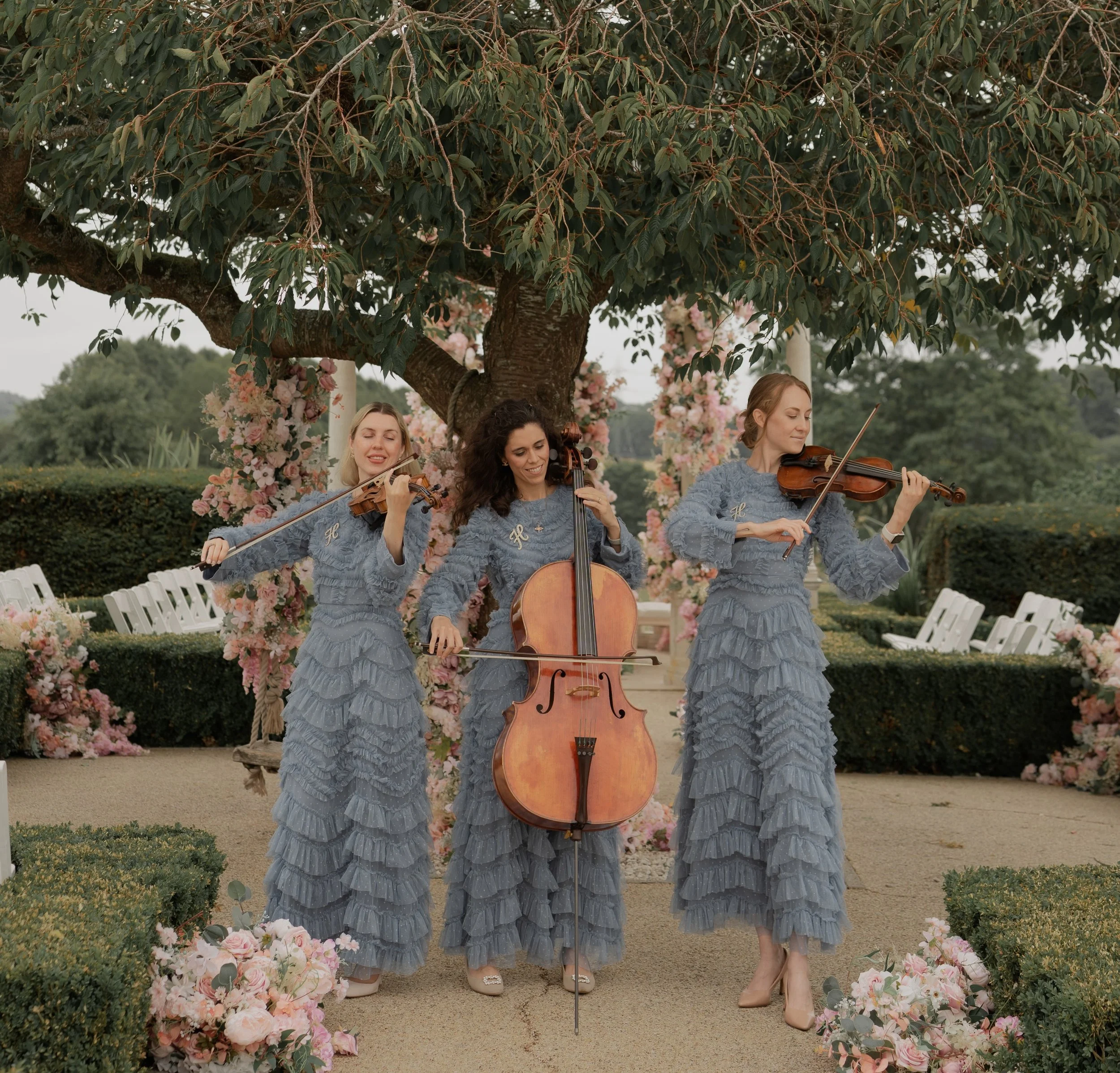 String trio performing live classical and pop music for an event