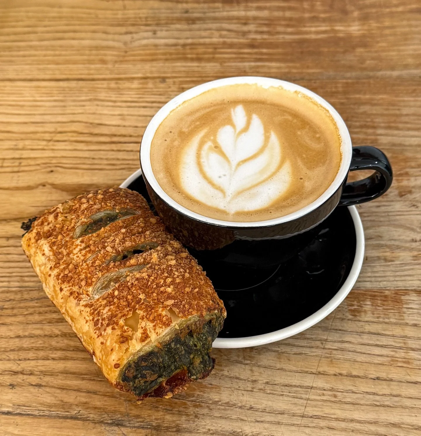 Savory or sweet for breakfast? Why not both? 
Try a delicious, savory Spinach Bureka from @navadbakers paired with our classic Maple Vanilla latte!