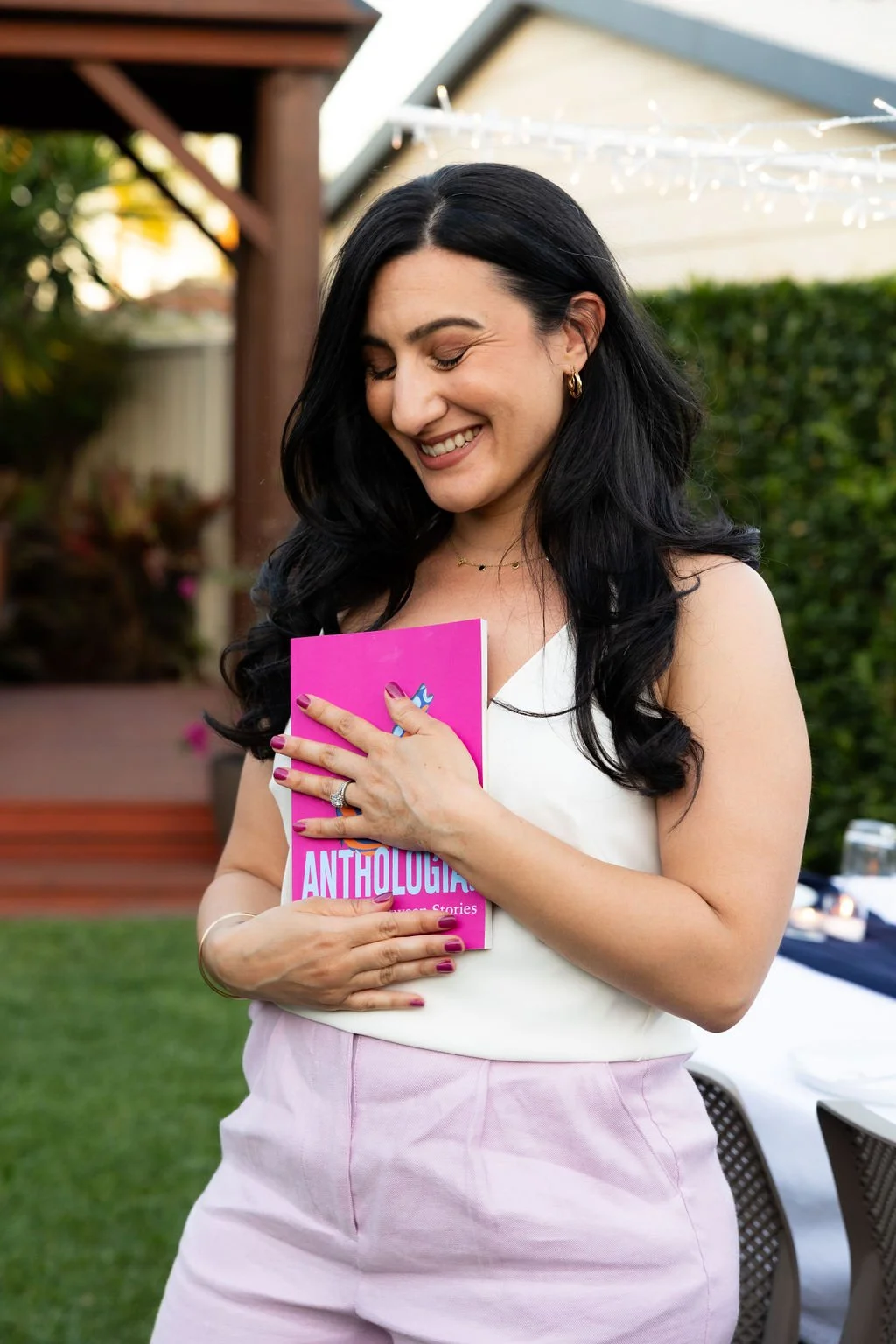 Daniella Elias holding Anthologia One