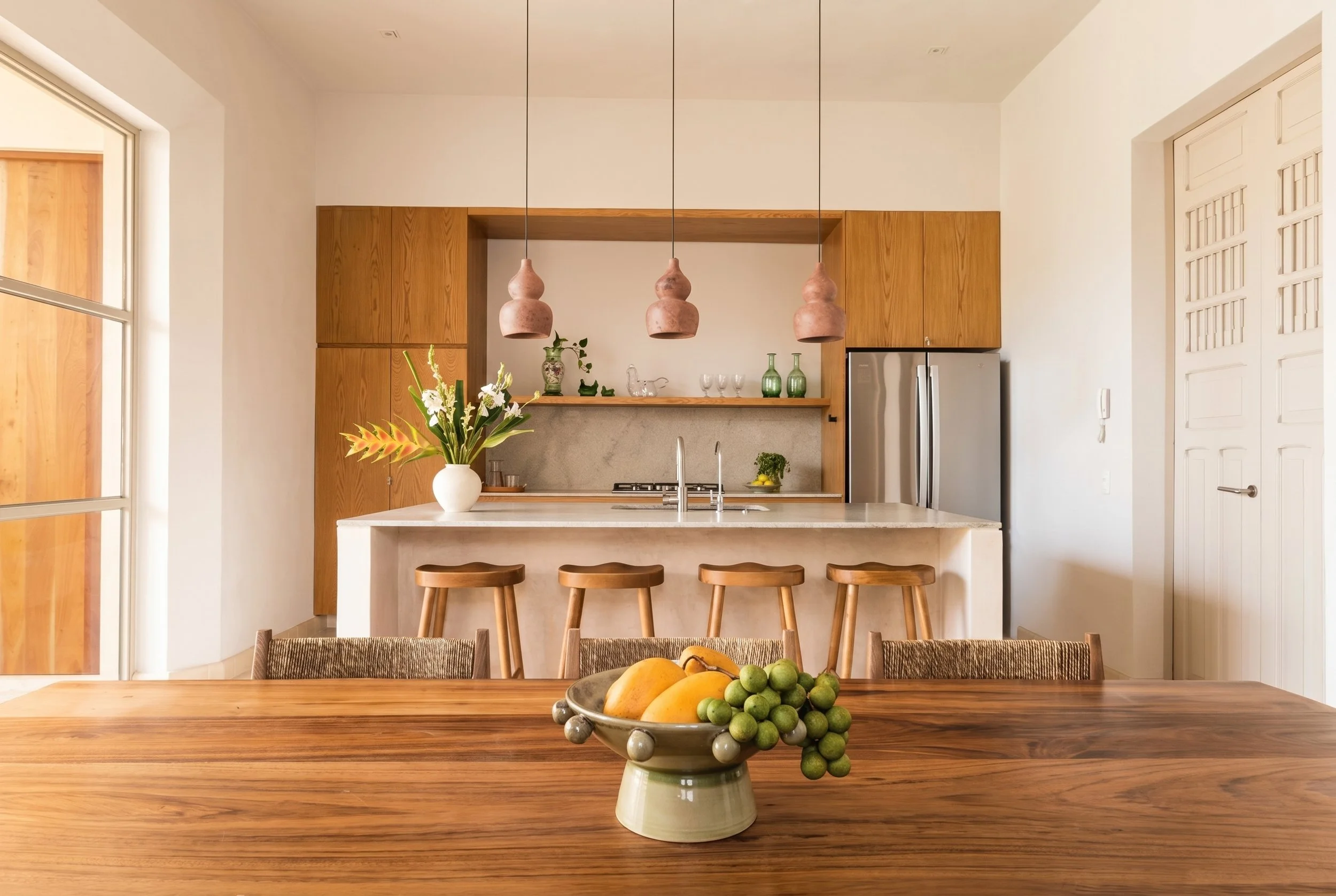 Casa Goliana kitchen featuring renovated original wood doors and historic finishes by Laseu Studio