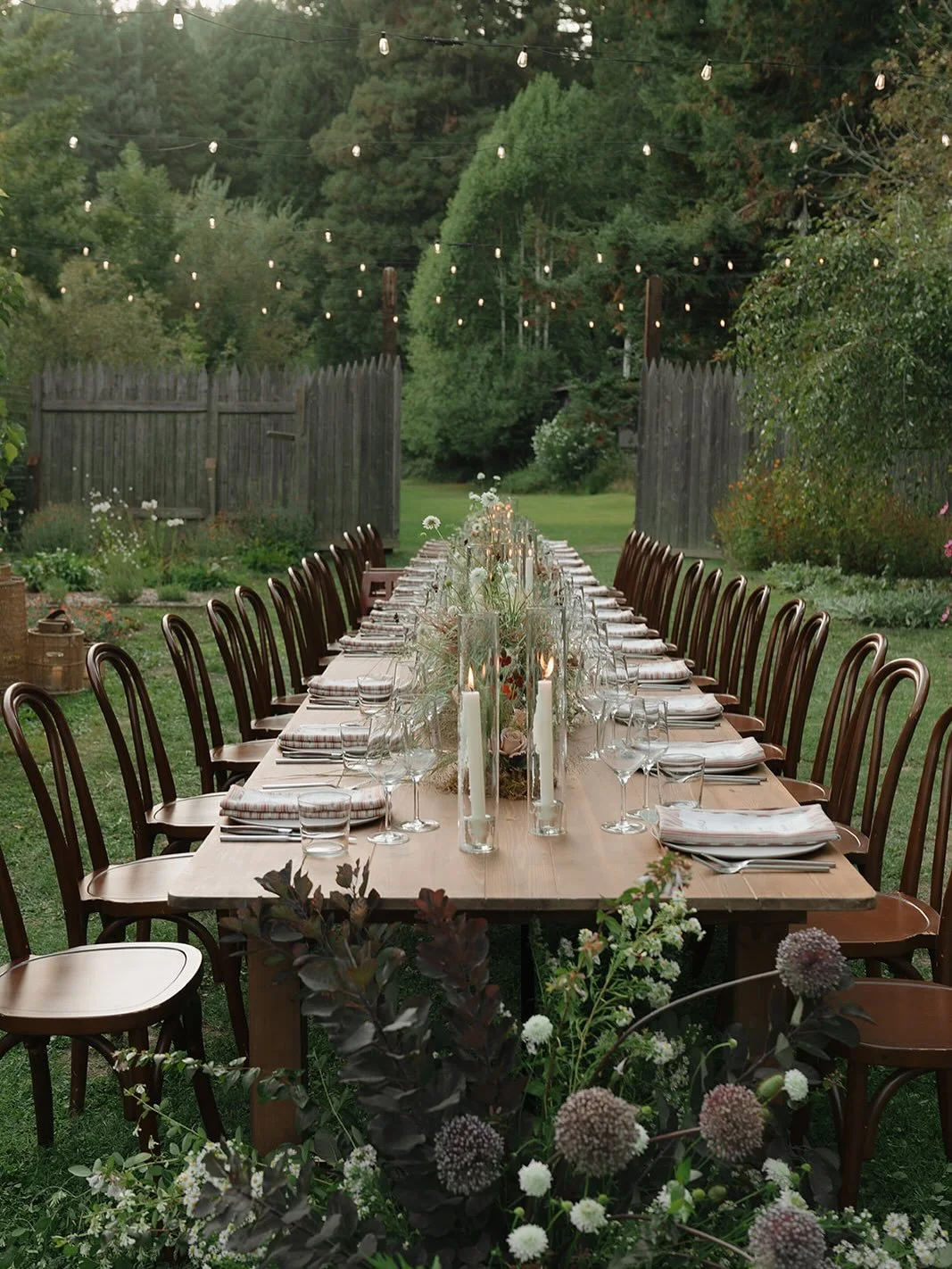 This super sweet wedding was full of intention, building off of the couple&rsquo;s love of nature and their intimate camp themed celebration. For the table flowers, I loved creating the meadow design, with lush foliage, grasses, and flowers sprawling