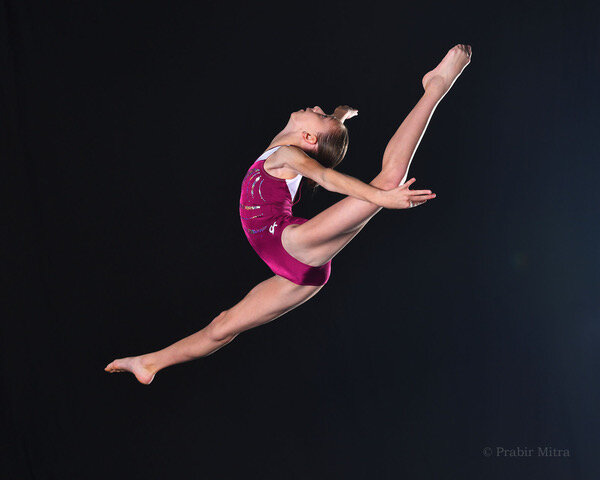 Gymnast (13-15) stretching one leg in air on balance beam, portrait Stock  Photo - Alamy