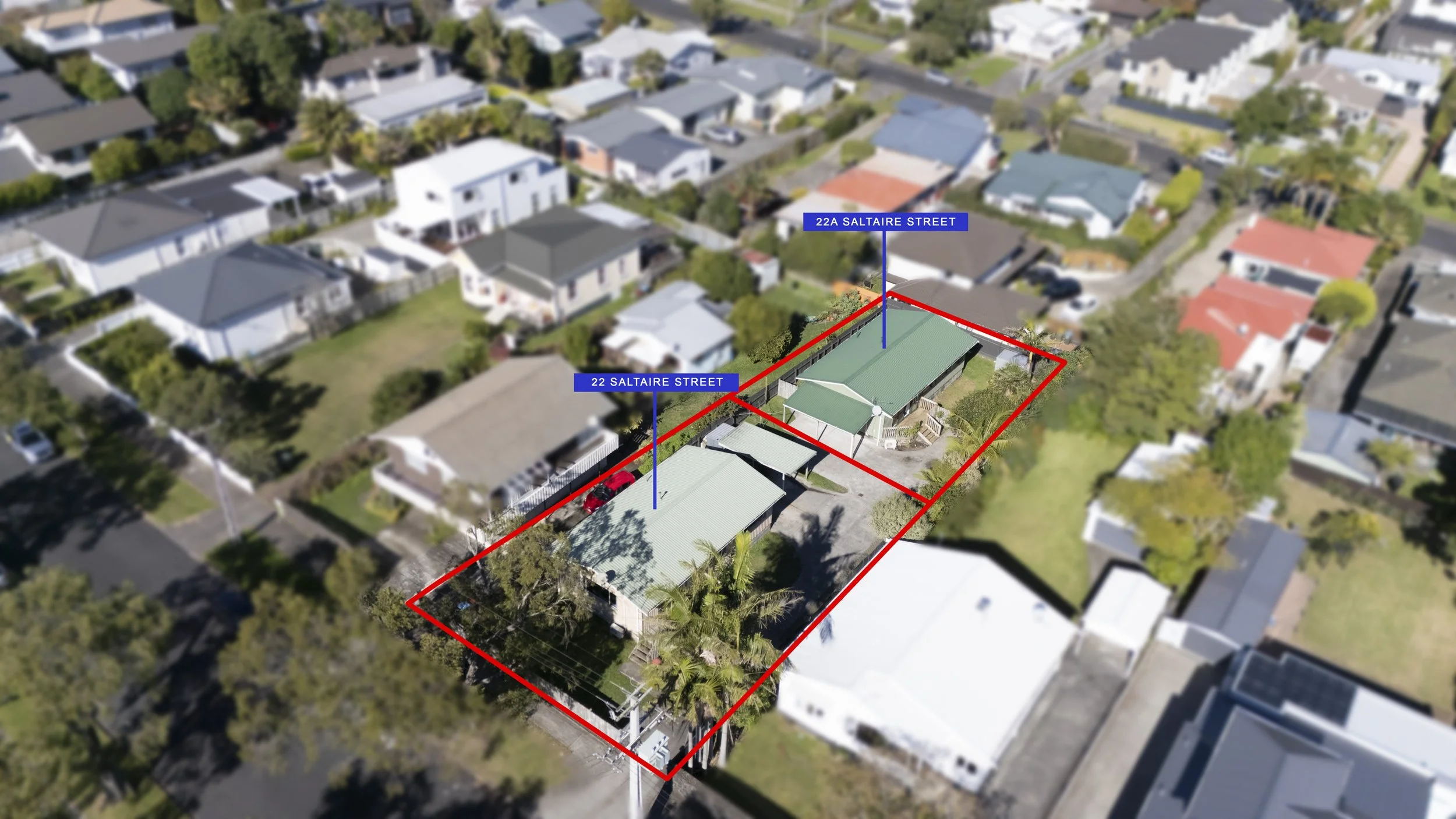Aerial view of a residential neighborhood with a house outlined in red and blue labels marking the address as 22A Saltaire Street, with surrounding houses, trees, and streets.