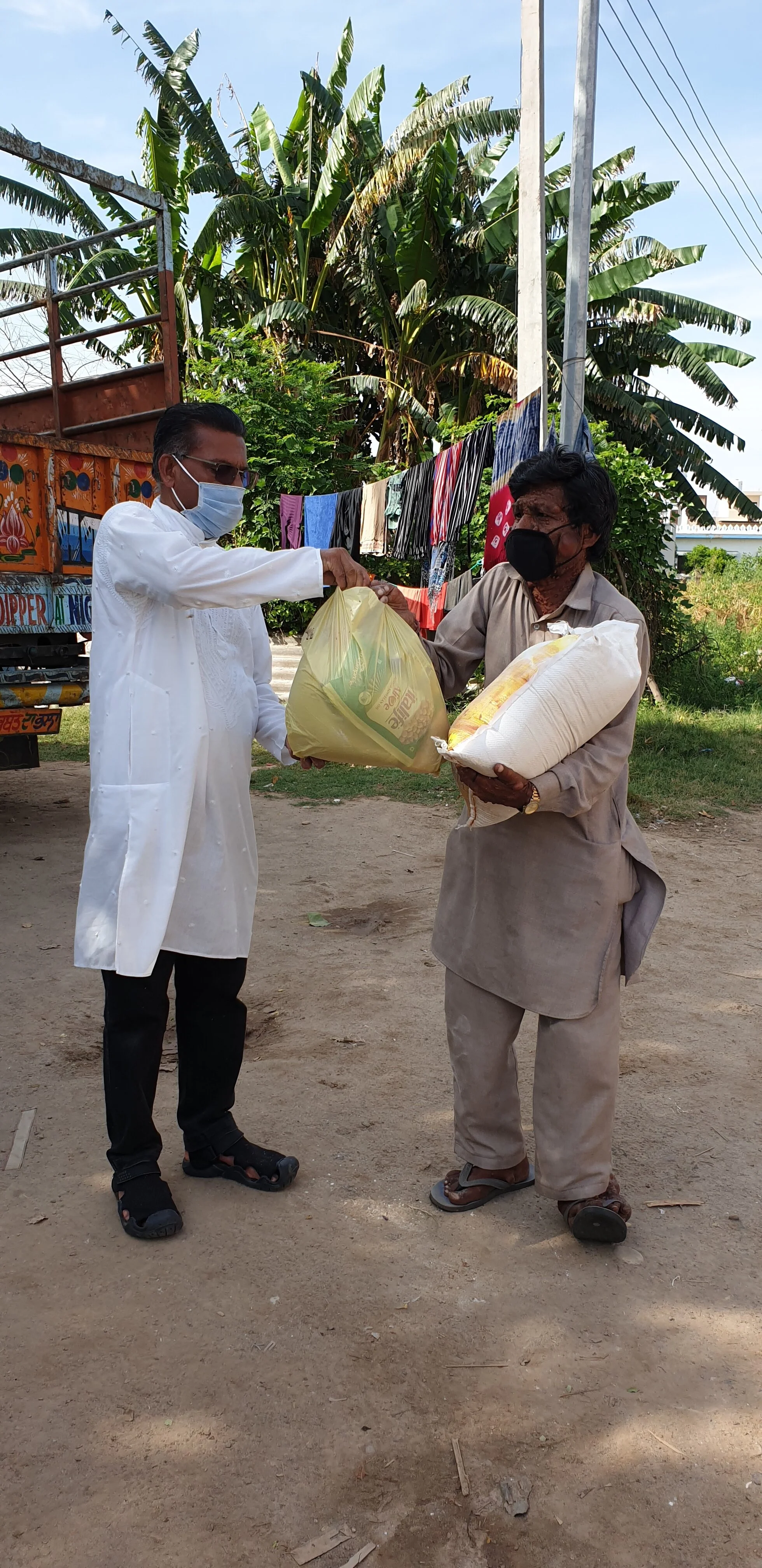 Distributing groceries among slums during the Covid-19 lockdown period in Punjab.