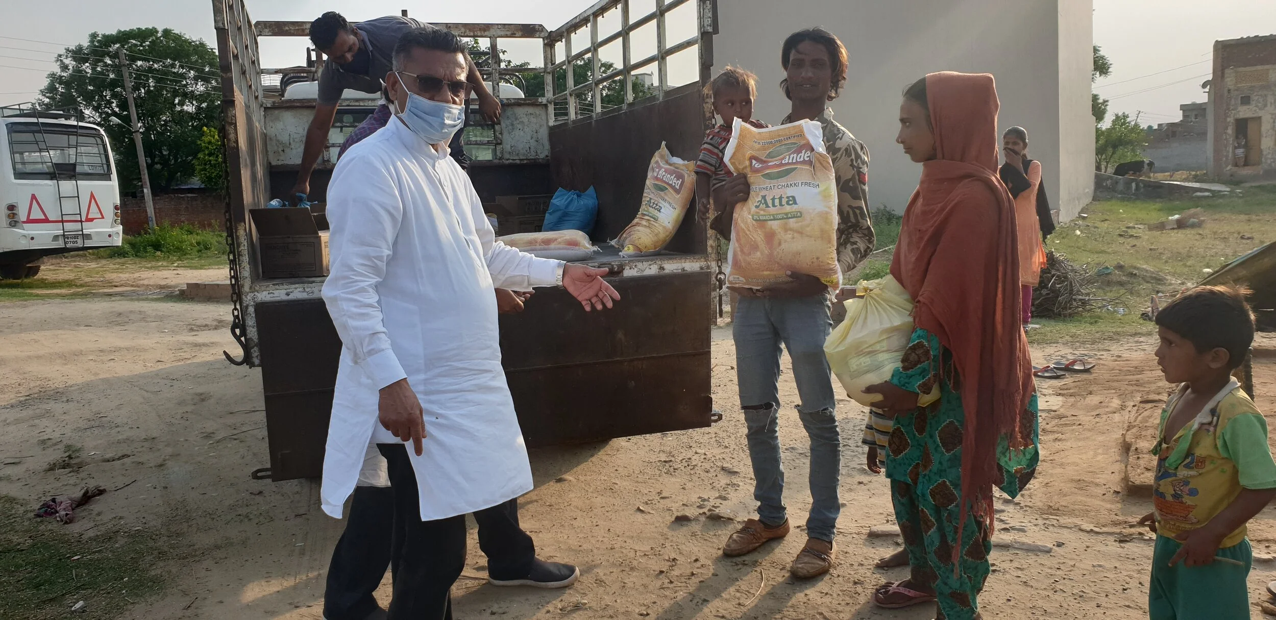 Distributing groceries among slums during the Covid-19 lockdown period in Punjab.