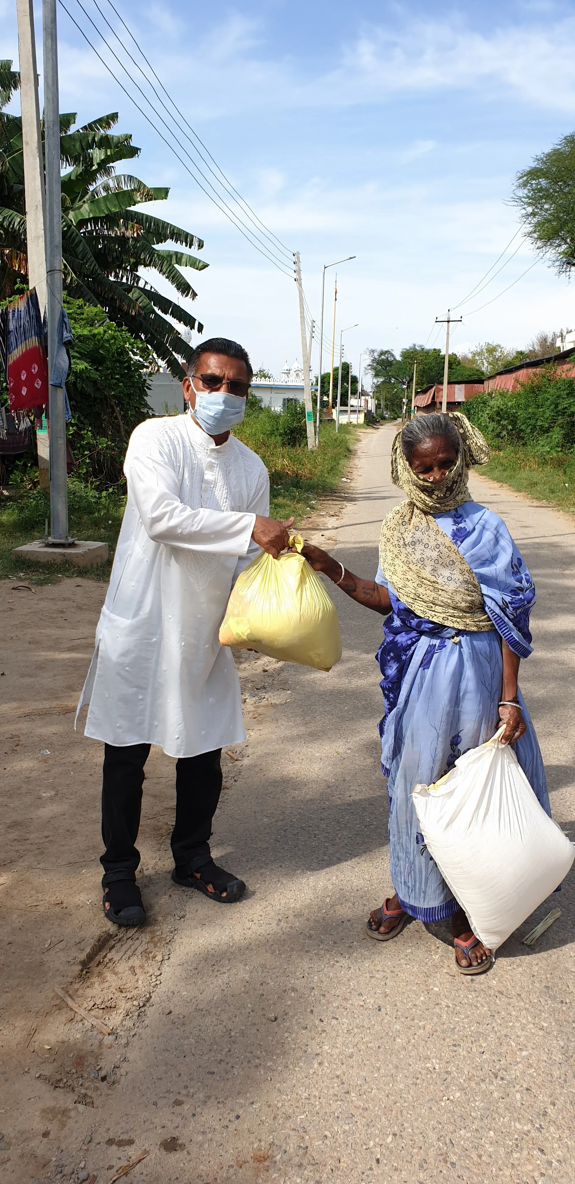 Distributing groceries among slums during the Covid-19 lockdown period in Punjab.